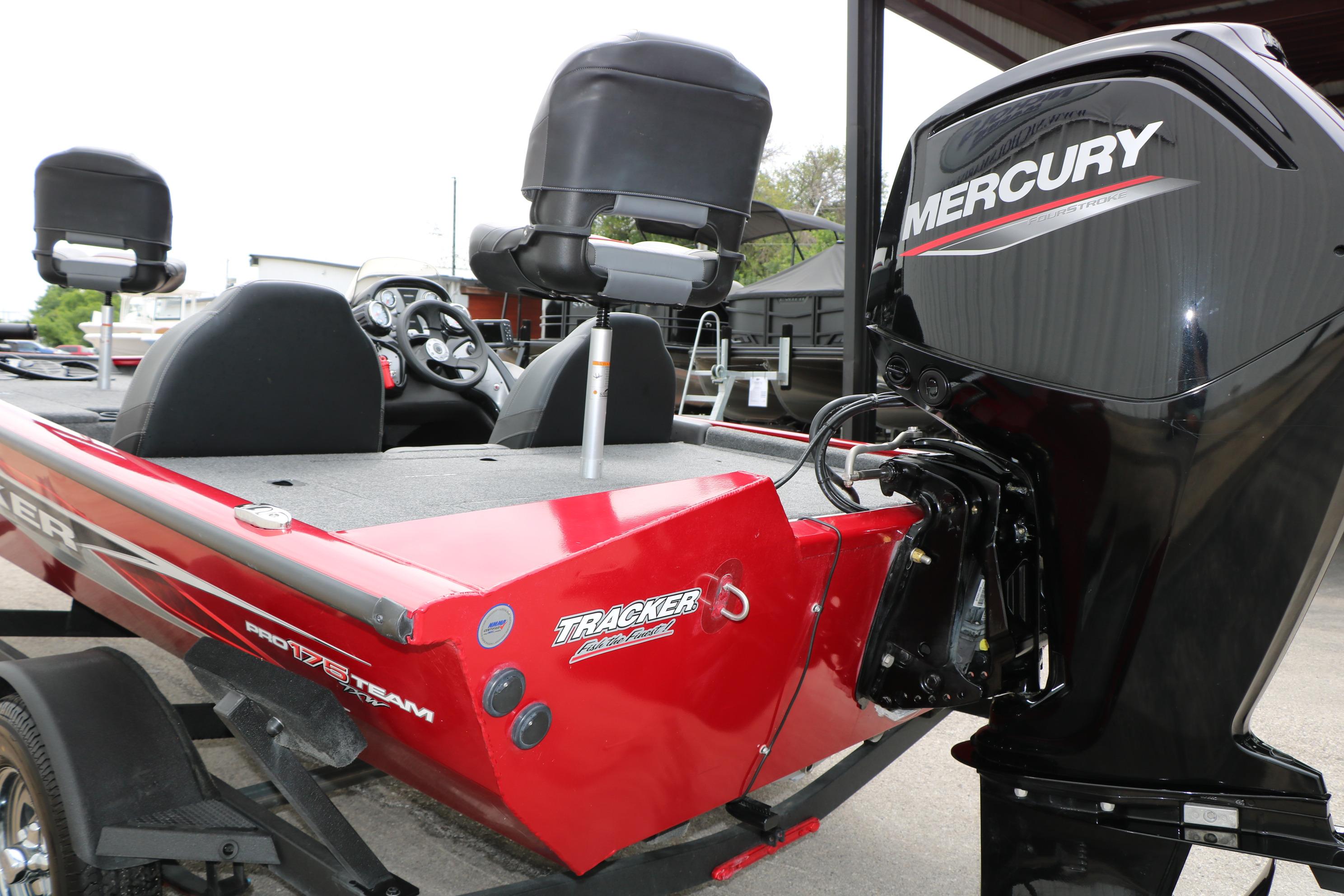 2024 Tracker Pro Team 175 boat with Mercury engine, red exterior, and dual seating.