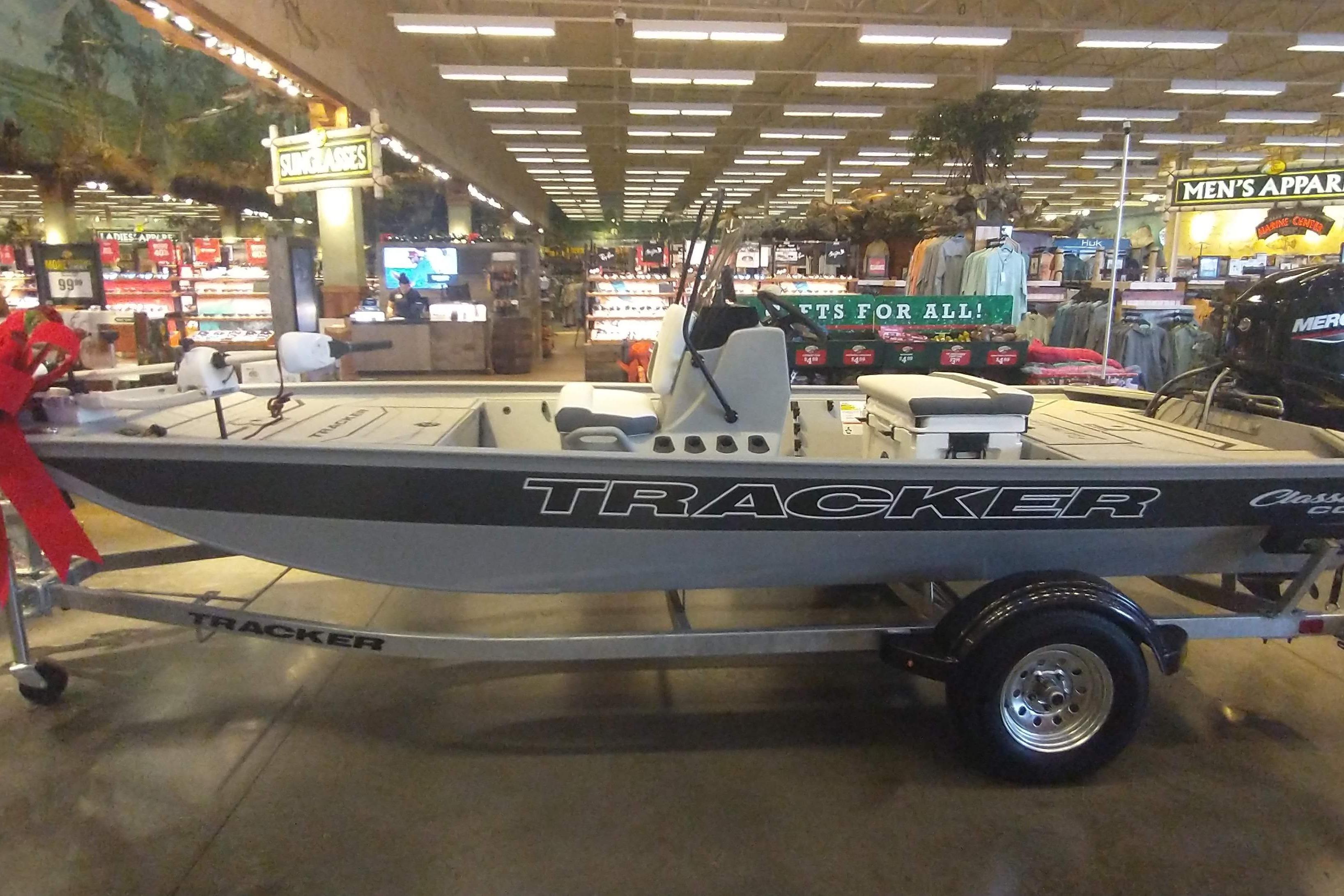 2026 Tracker Bass Tracker Classic CC boat displayed indoors on a trailer.