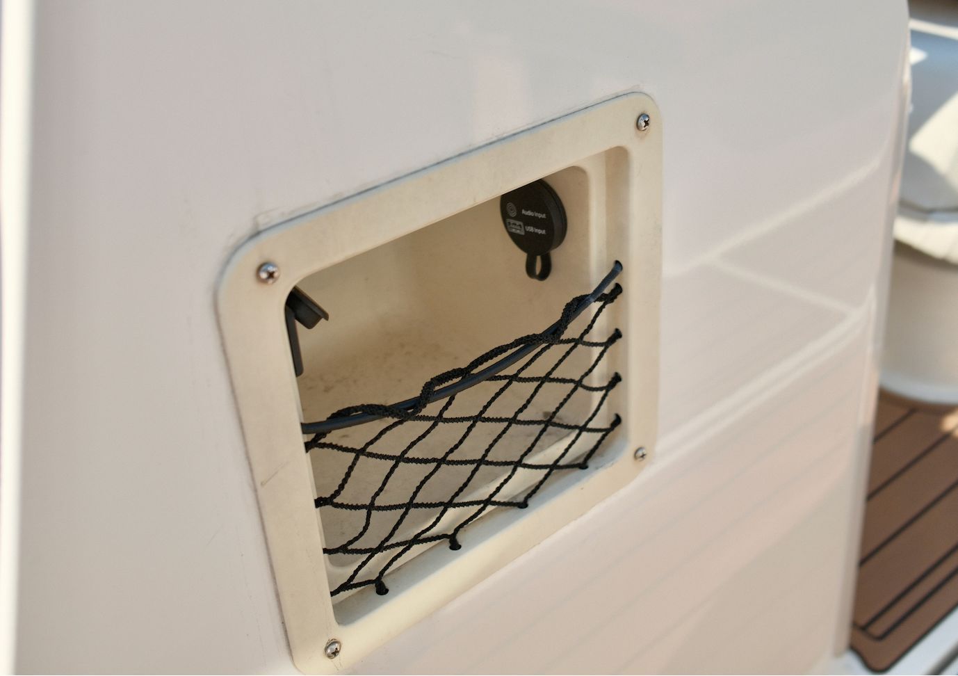 A netted storage compartment on a 2019 Bayliner VR4 Bowrider OB.