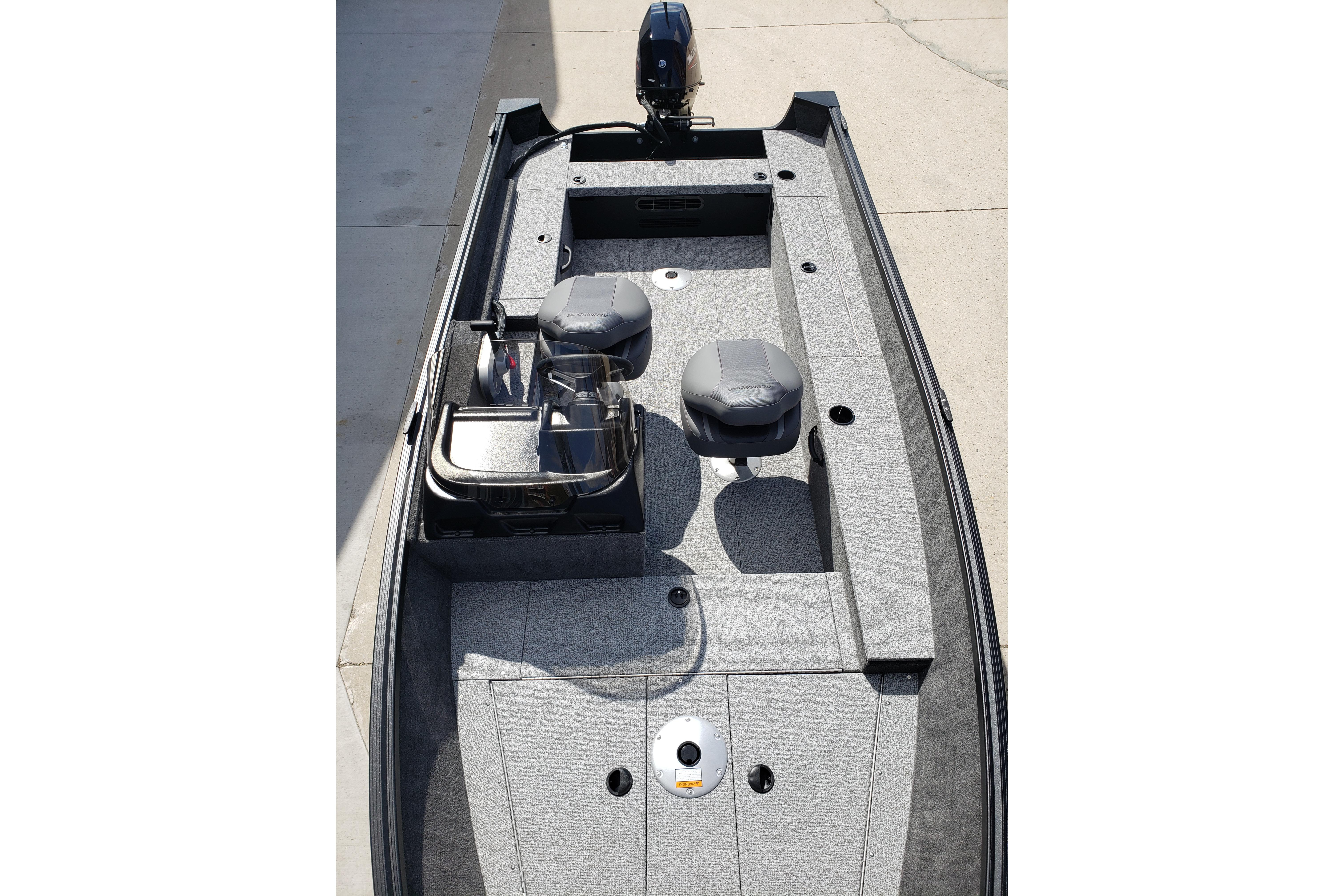 2026 Alumacraft Escape 165 CS boat interior with seating and motor, viewed from above.