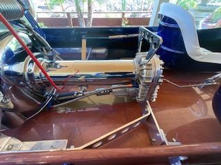 Close-up of a shiny boat engine with polished metal components.