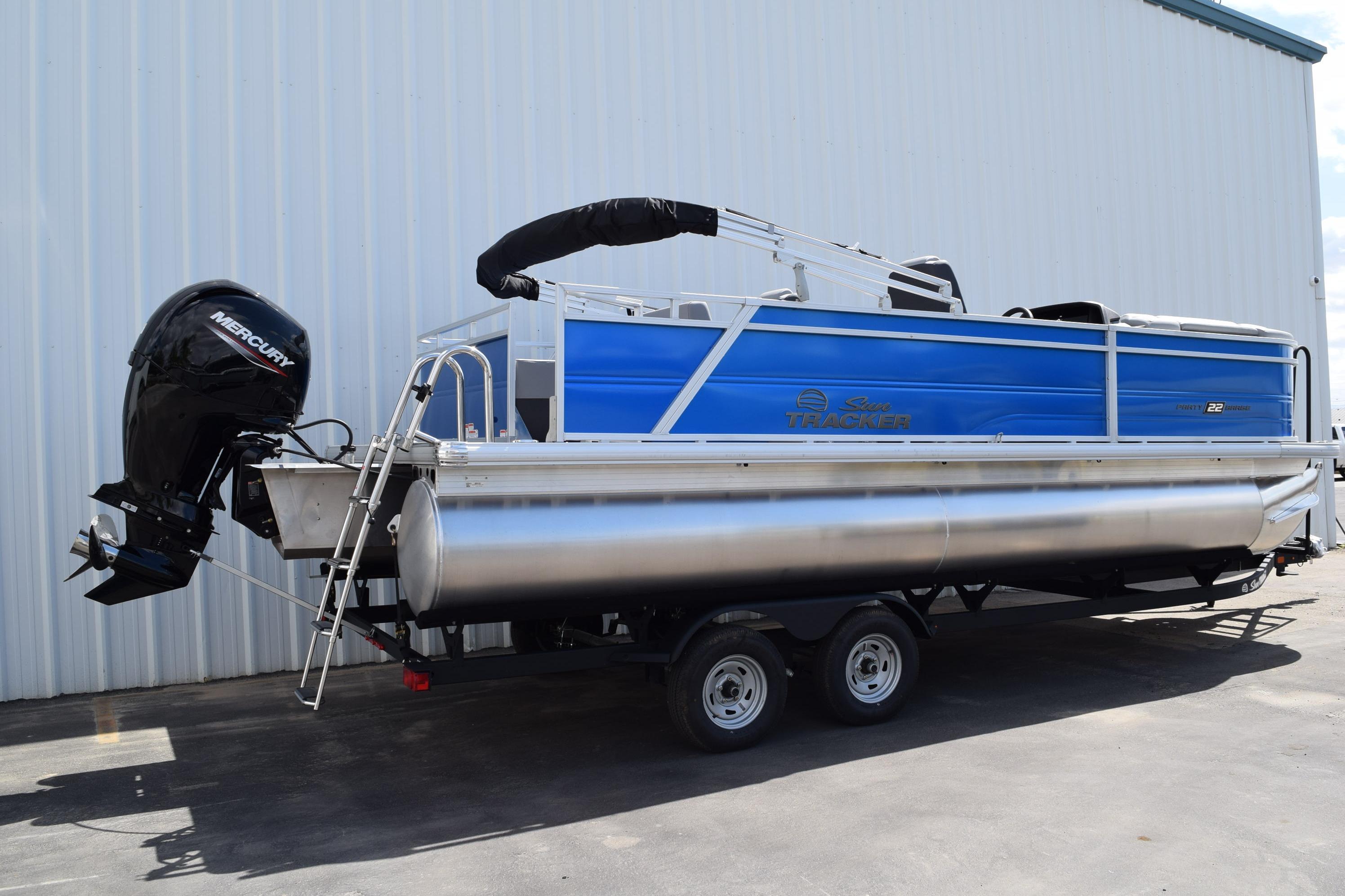 2026 Sun Tracker Party Barge 22 RF DLX pontoon boat with Mercury outboard motor.