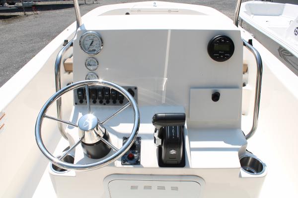 2023 Sundance DX20 boat console with steering wheel and controls.