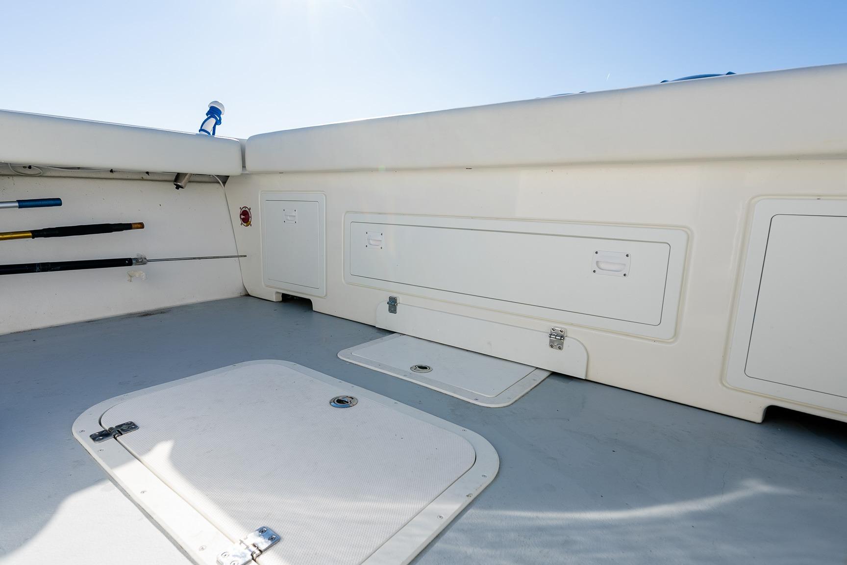2024 Steiger Craft 31 Fisherman boat interior with storage compartments and fishing rod holders.