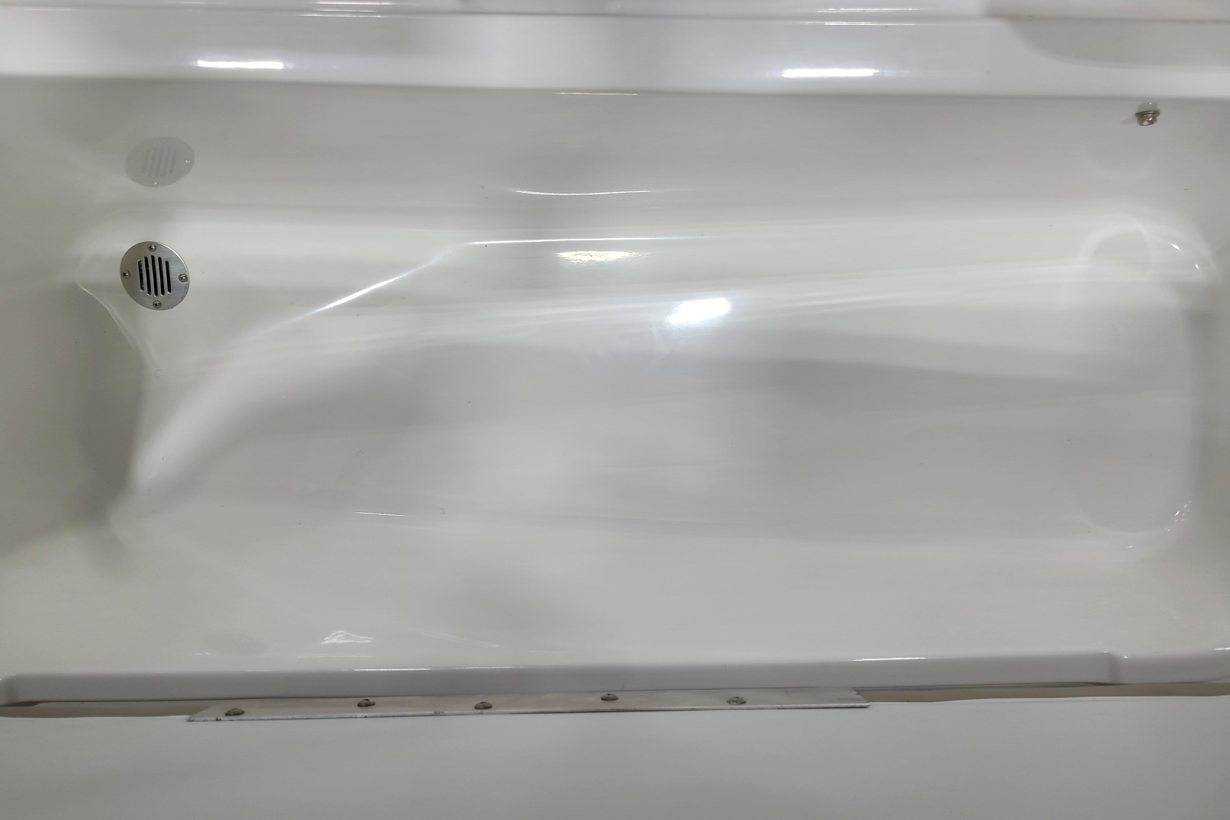 2026 Tahoe 2150 boat interior with sleek white finish and drainage feature.