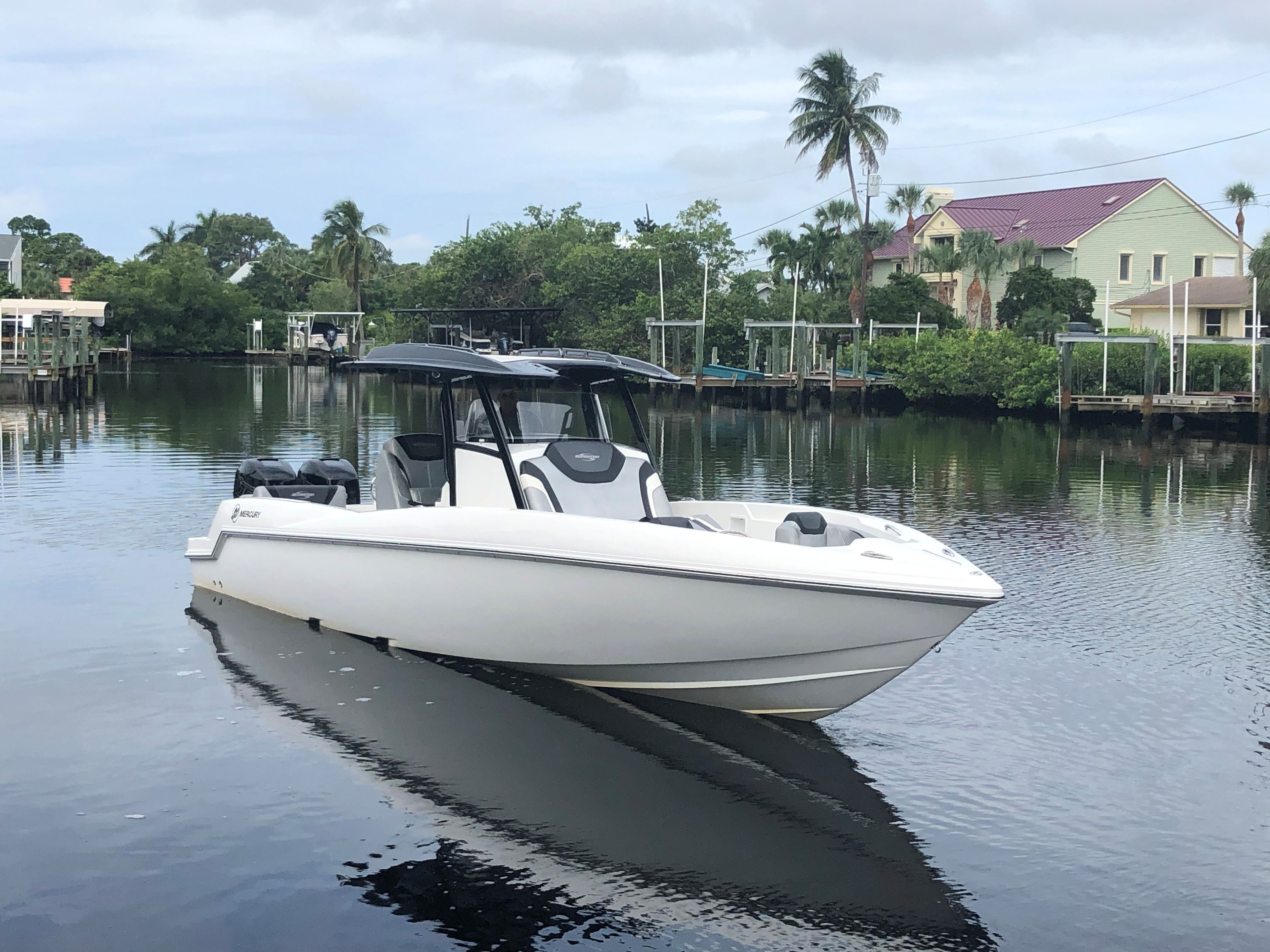 2017 Sunsation 32 CCX boat anchored on calm water.