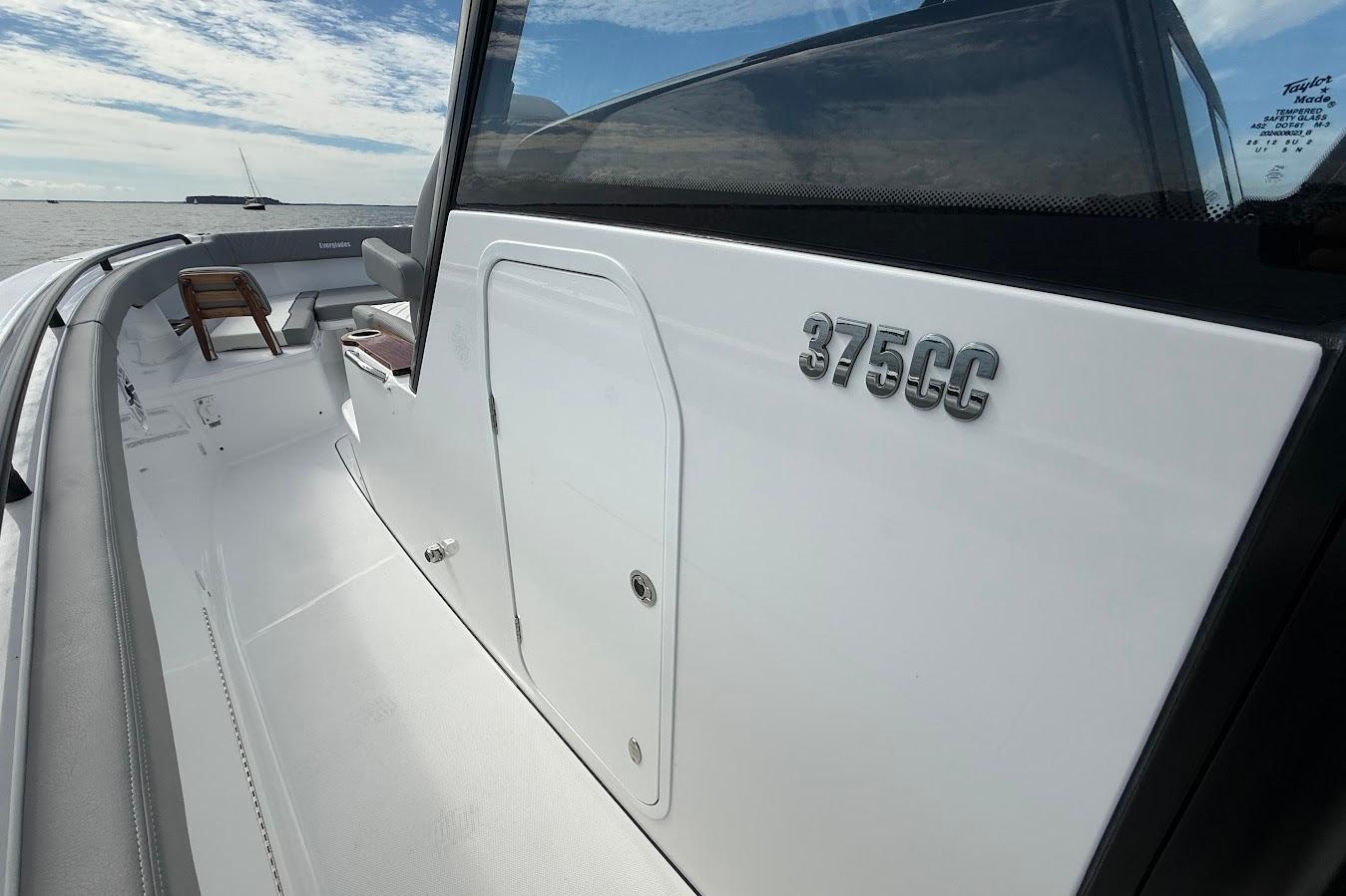 2026 Everglades 375 Center Console boat, sleek design, open deck, ocean backdrop.