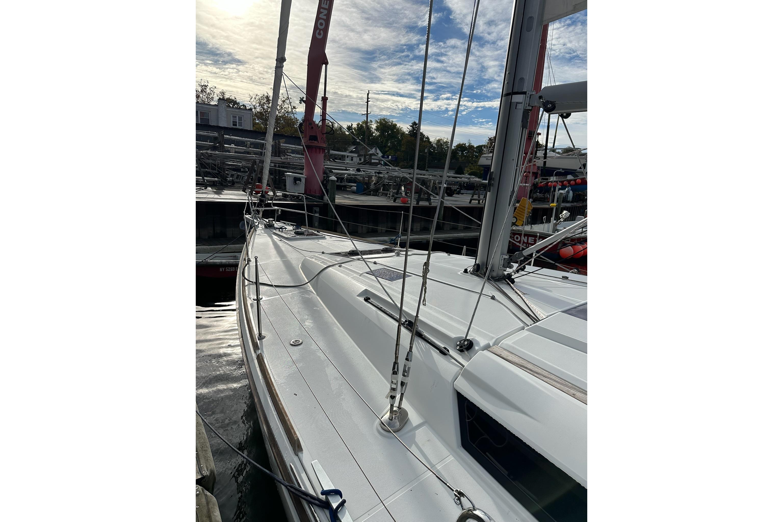 2018 Jeanneau Sun Odyssey 479 sailboat docked, showcasing sleek deck design and rigging.