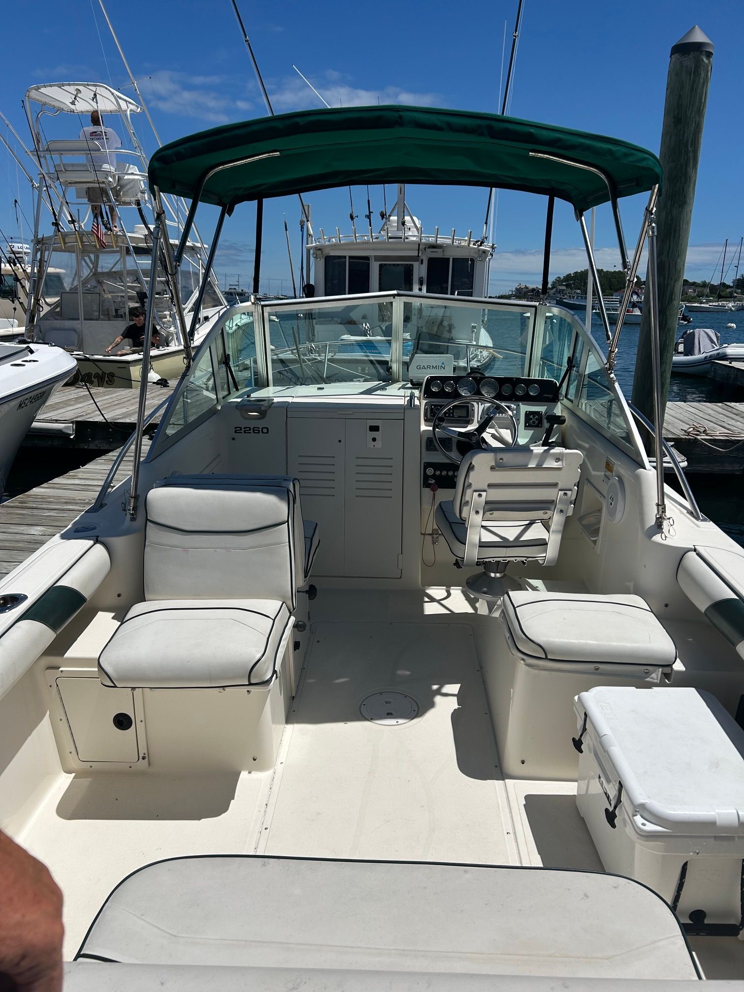 1999 Pursuit Denali boat docked, interior view with helm station.