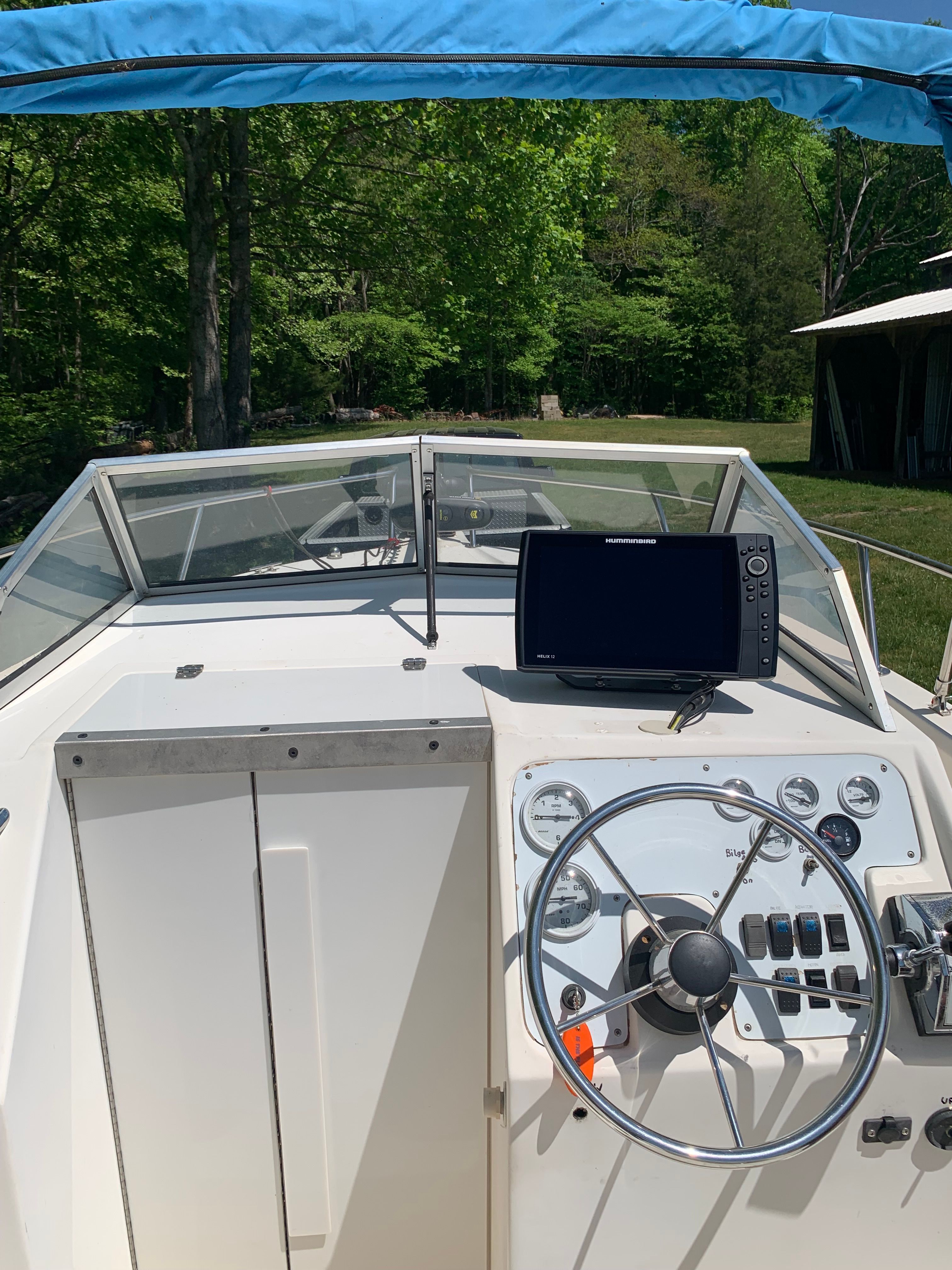 Interior view of a 1998 Eurosport 221WA boat with steering console.