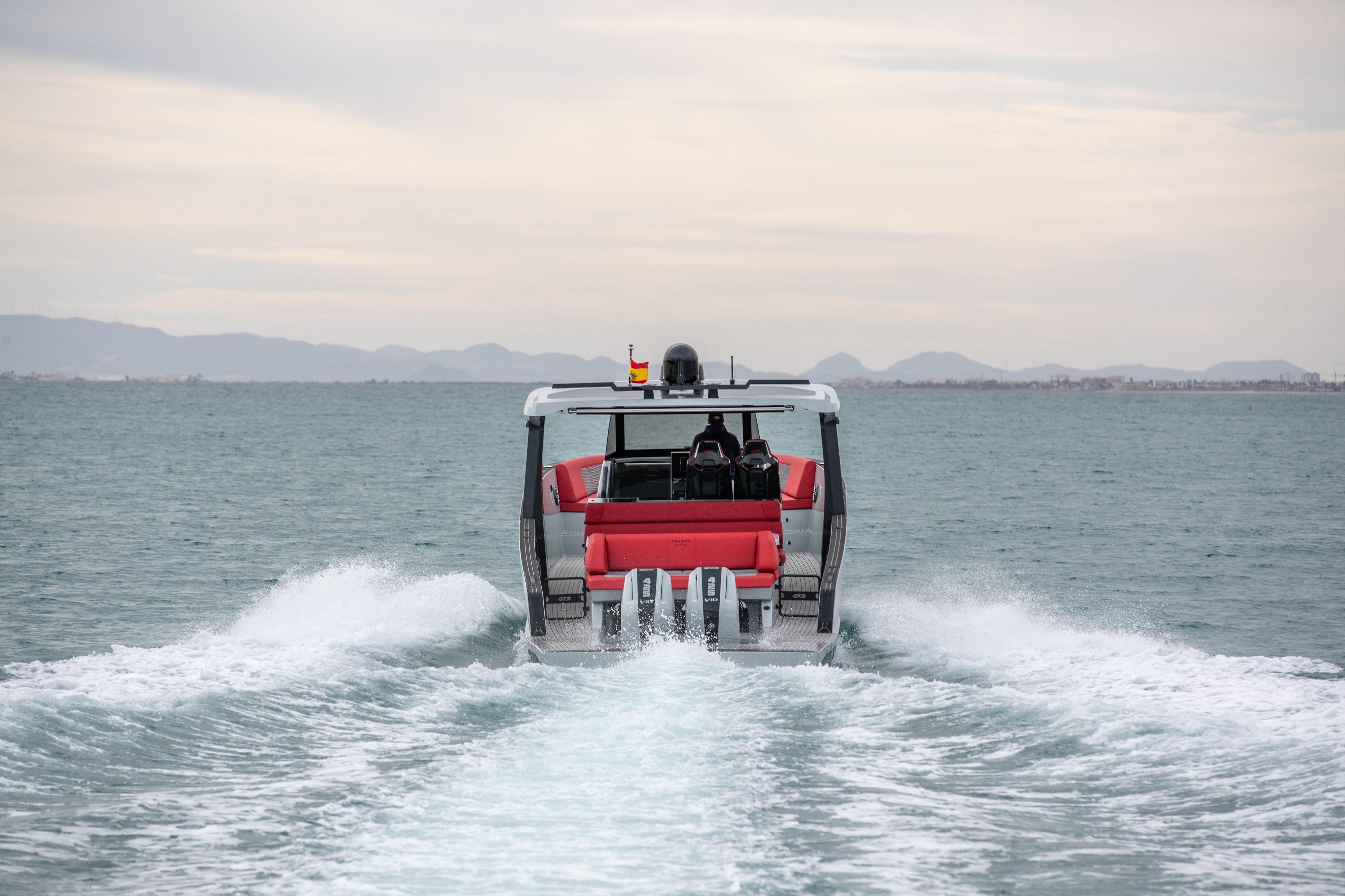 Tesoro 40 GTS 2026 cruising on open sea, rear view.