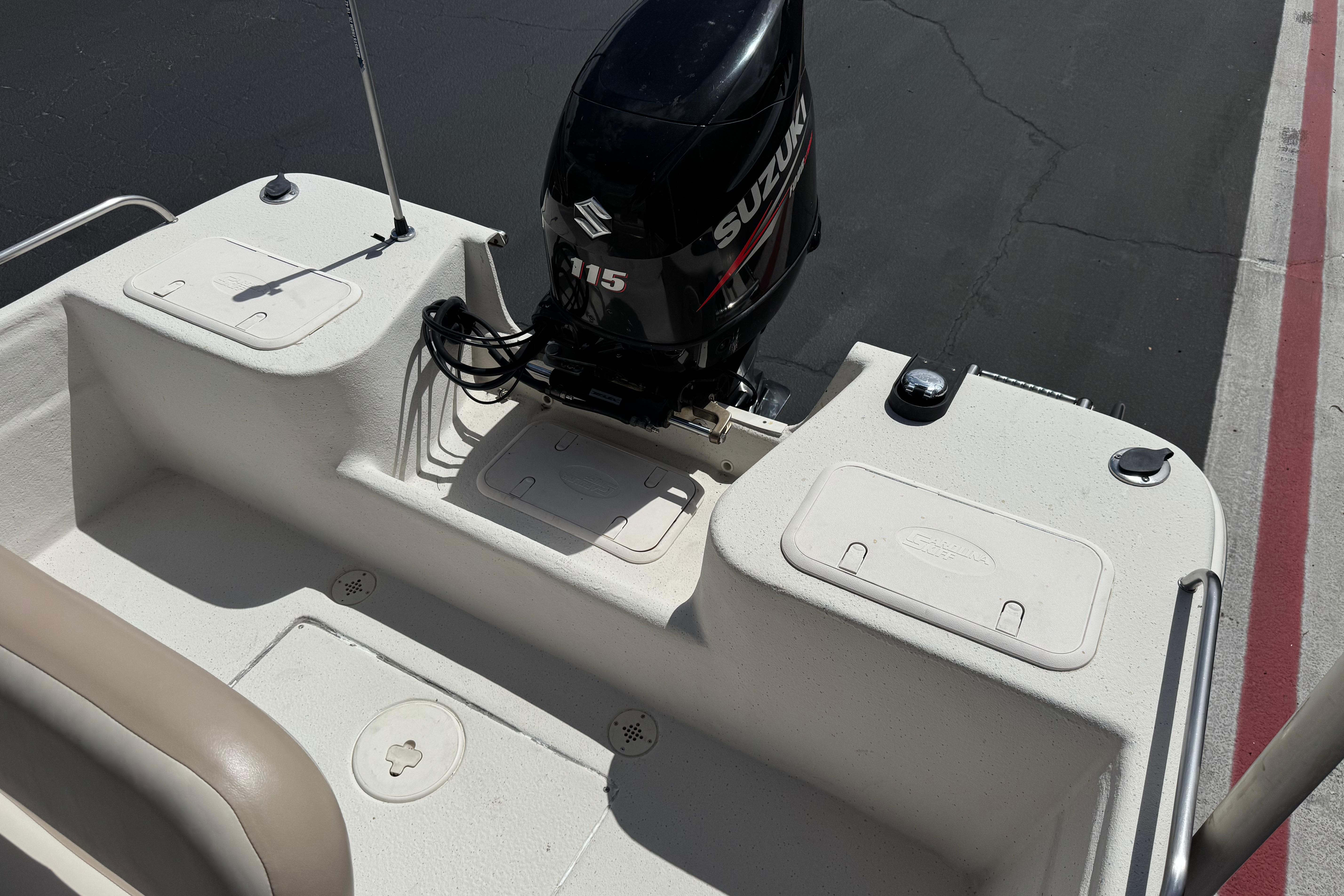 2013 Carolina Skiff Sea Chaser 1950 RG with Suzuki 115 outboard motor.