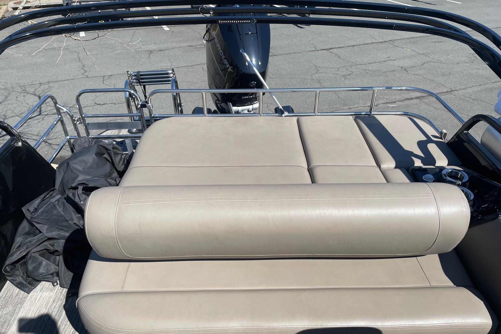 2024 Ranger 2500LS boat with beige leather seating and stainless steel railings.