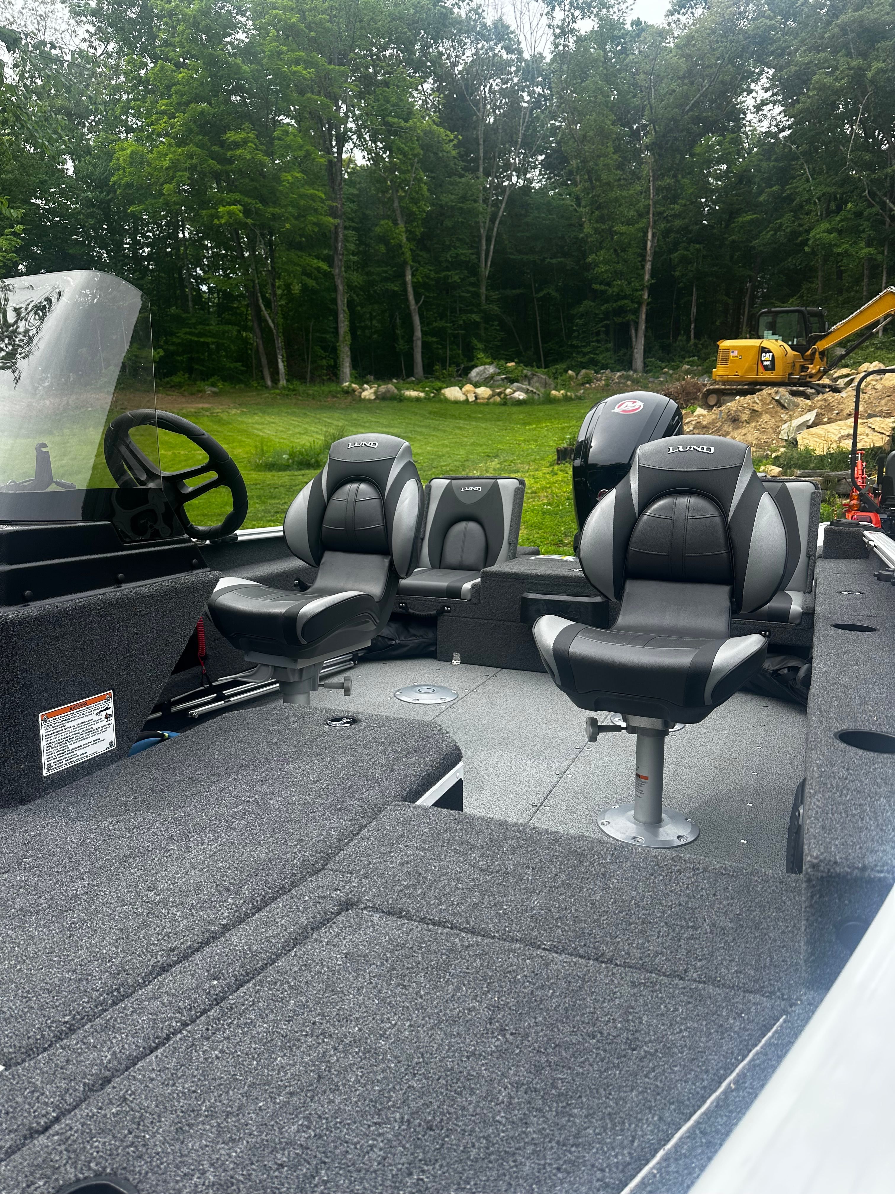 Interior of 2025 Lund 1775 Adventure SS with gray seats.