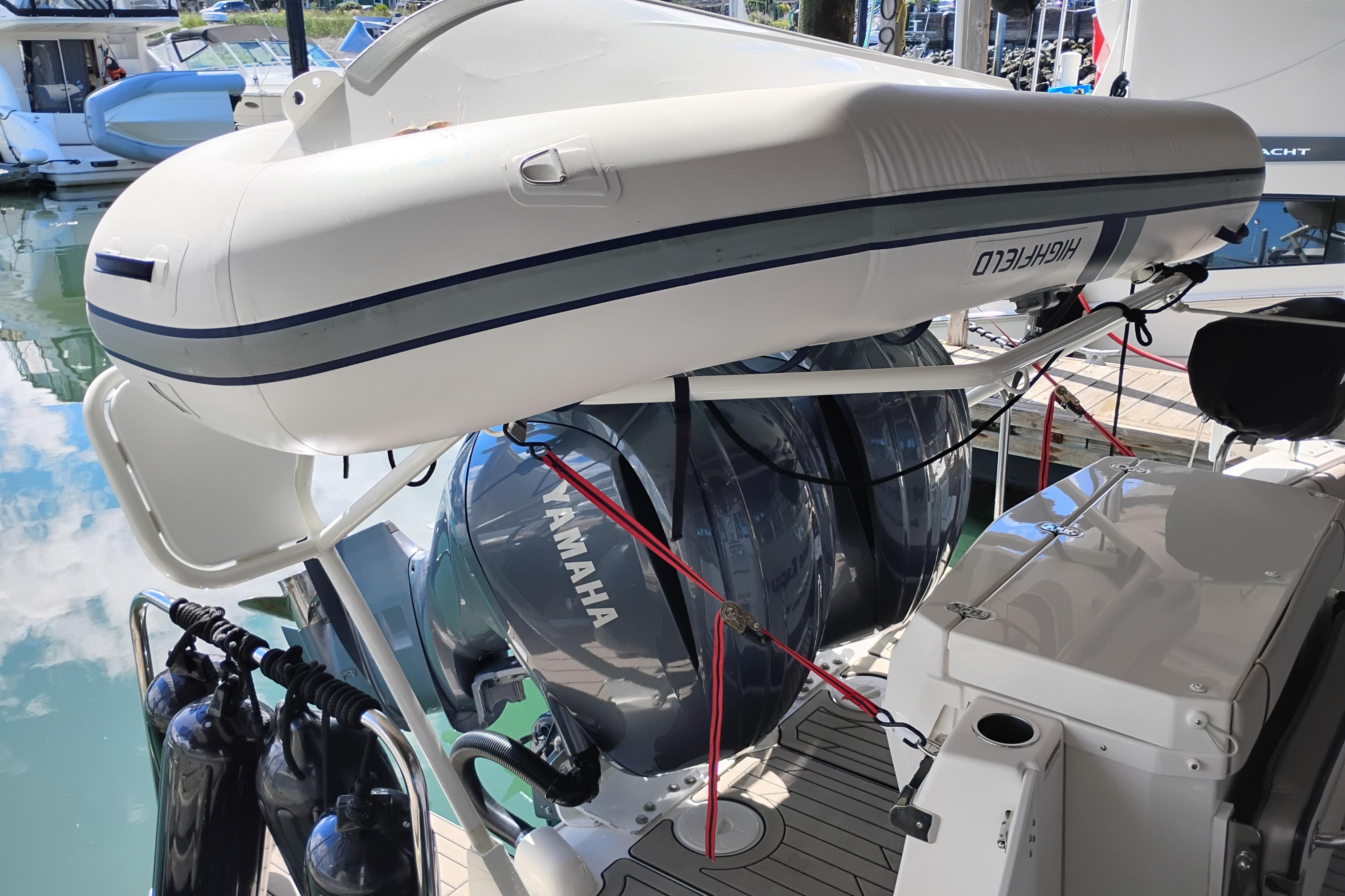 2022 Cutwater C-32 Coupe with Yamaha engines and Highfield inflatable boat on deck.