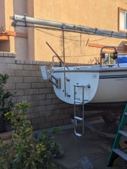 Catalina Capri 2002 sailboat in backyard, stored on land.