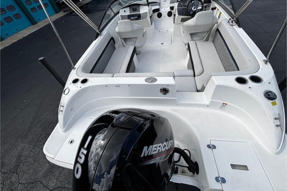 2022 Hurricane SunDeck 217 OB boat interior with Mercury engine, featuring spacious seating.