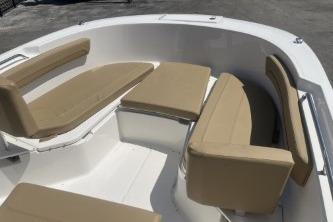 2023 Trophy T24 CC boat interior with beige cushioned seating.