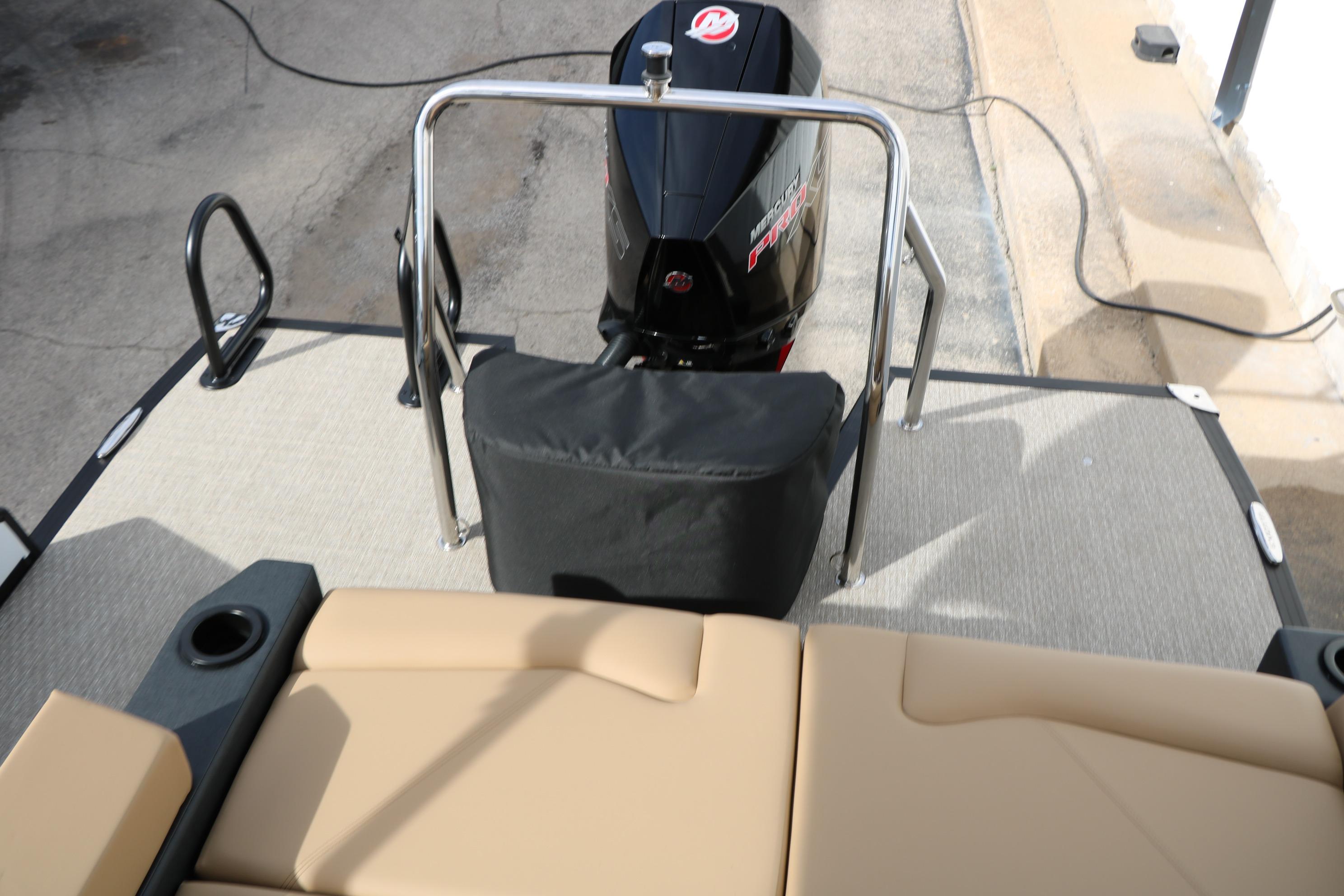 2026 Evotti 523CS boat with Mercury engine, beige seating, and rear deck view.