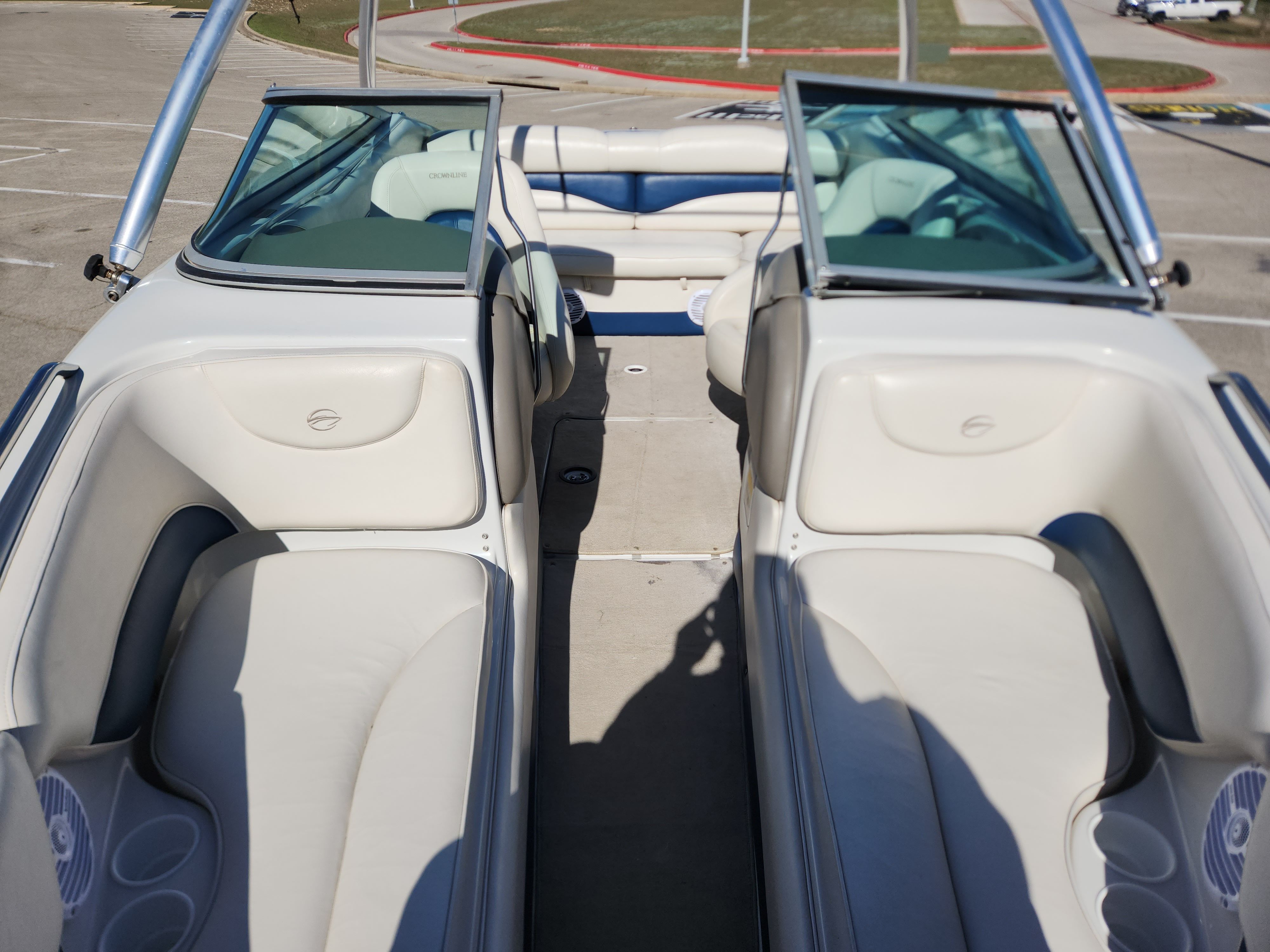 Interior of a 2003 Crownline 225 BR boat with beige seating.
