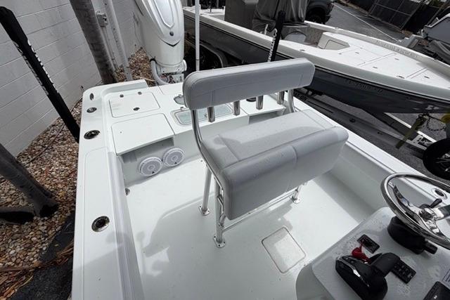 2025 Contender 26 Bay boat interior with seating and steering wheel.