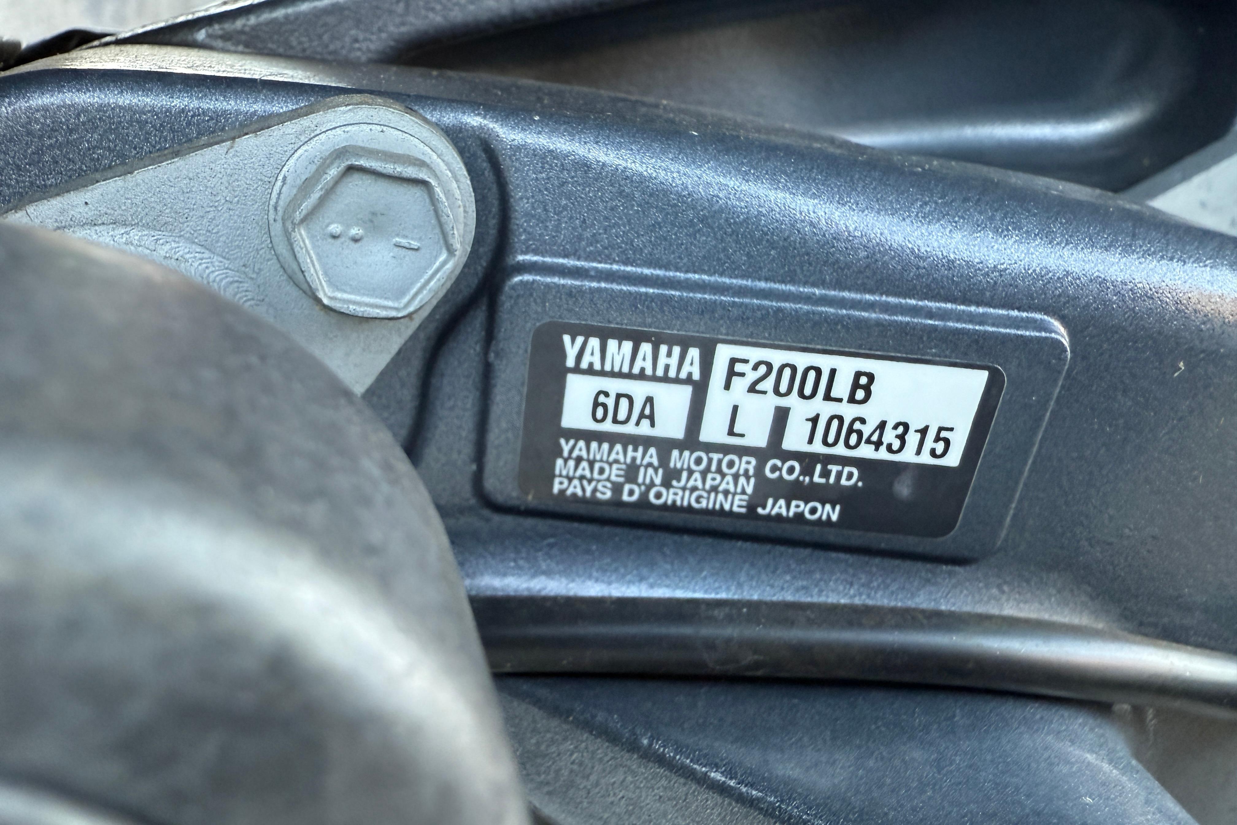 Yamaha F200LB engine label on 2011 Tahoe Pontoon 2485 DRL, made in Japan.