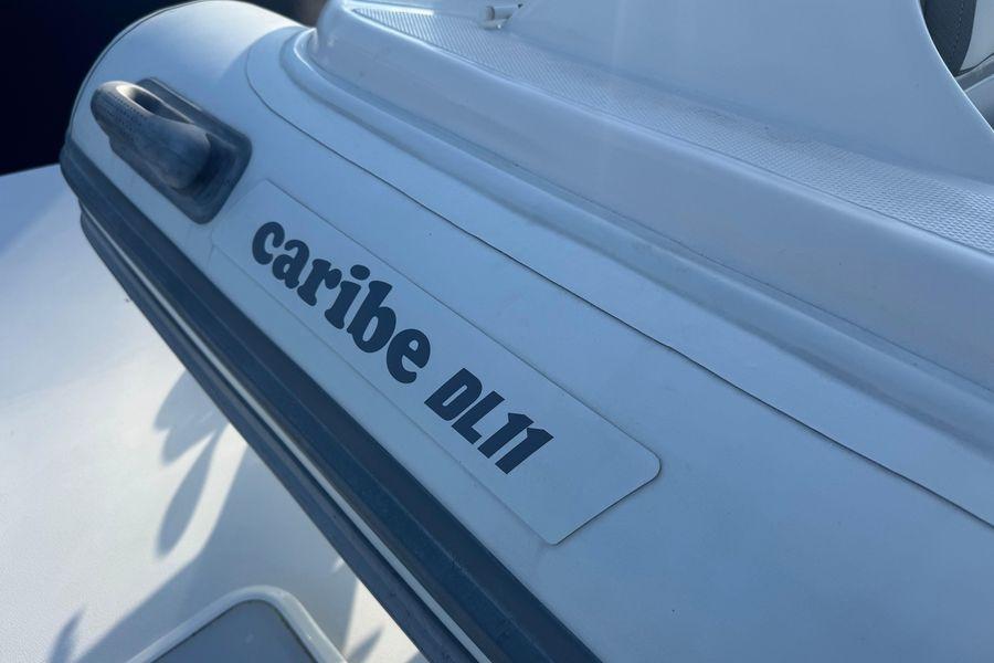 Caribe DL11 inflatable boat on 2002 Viking 61 Enclosed Bridge yacht.