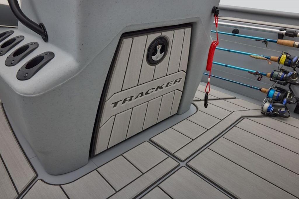 2026 Tracker Bass Tracker Classic CC boat interior with rod holders and storage compartment.