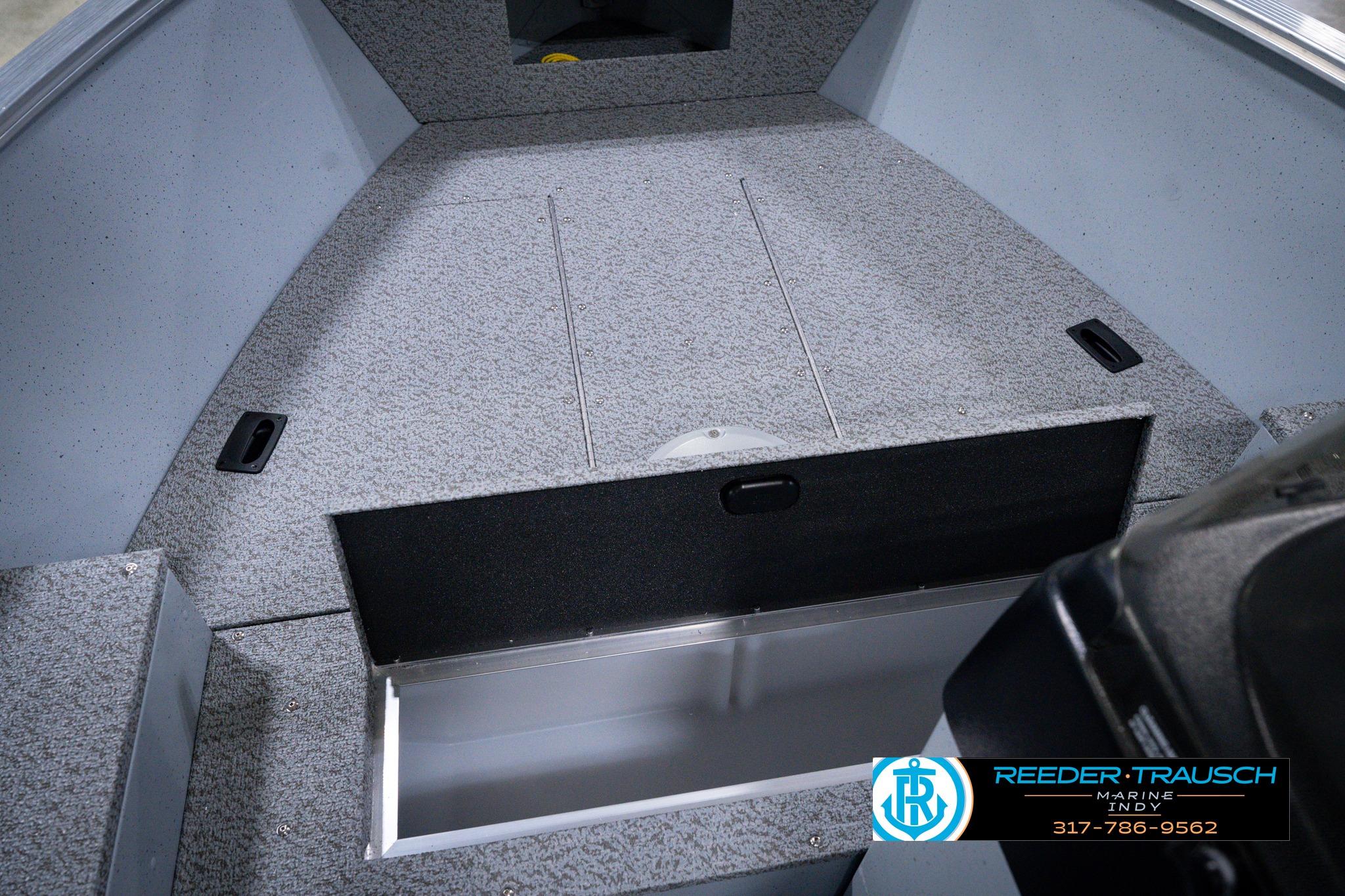 2026 Lund 1600 Fury SS boat interior with storage compartment open, showcasing spacious design.