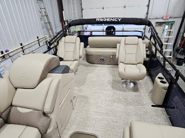 2024 Regency 250 DL3 pontoon boat interior with luxurious seating and modern design.