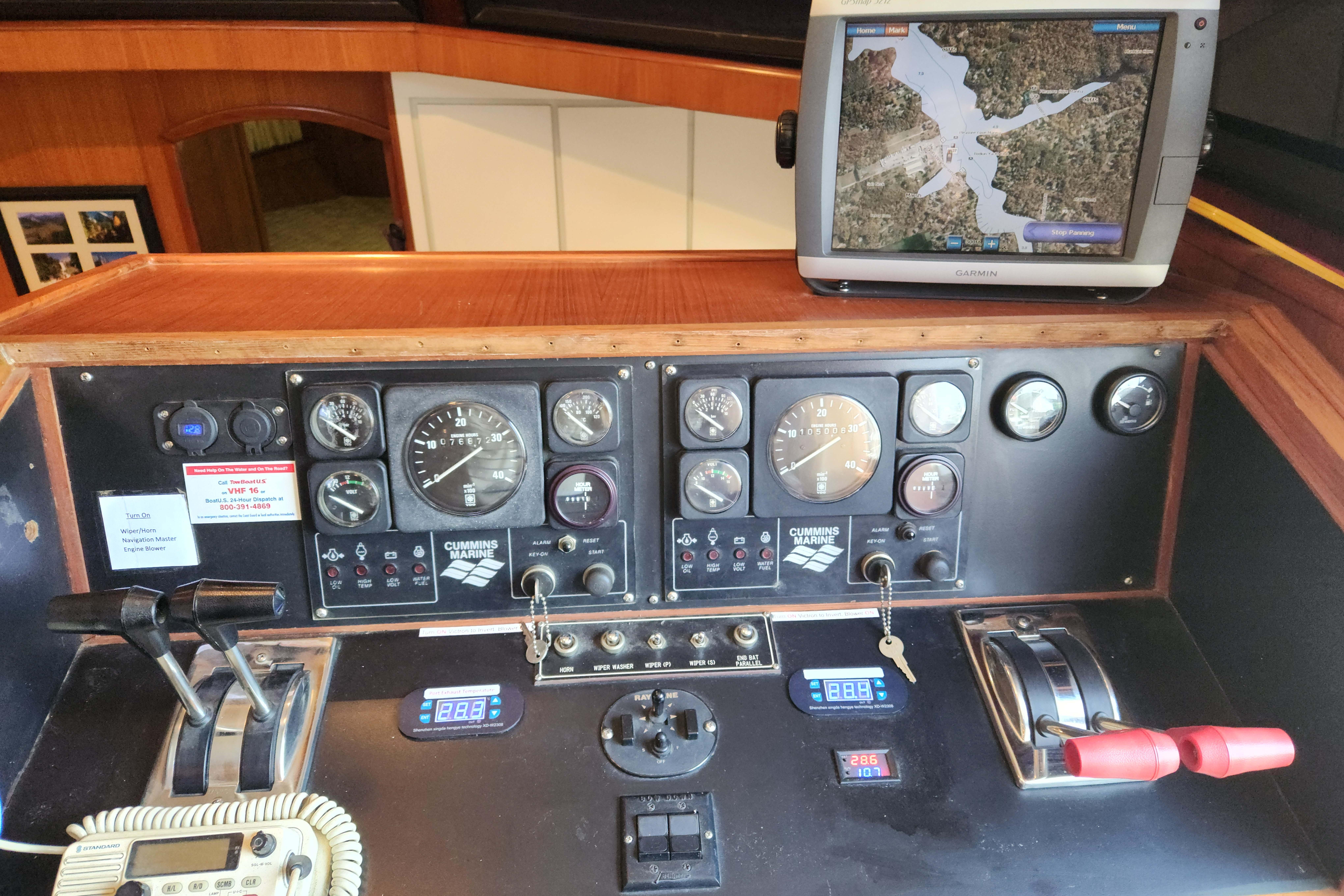 Control panel of a 1989 Hyatt Double Cabin Motoryacht with navigation screen.