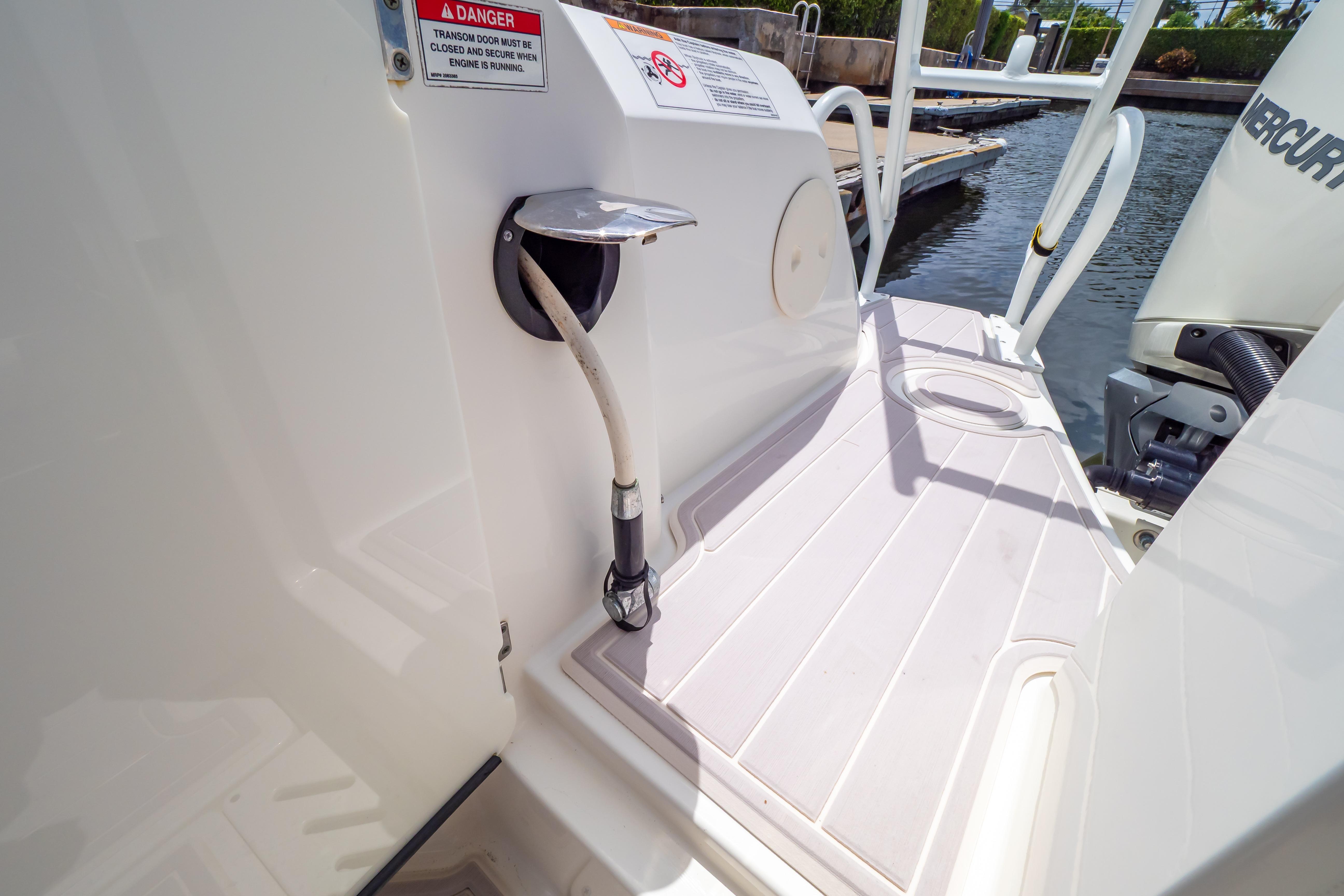 2019 Boston Whaler 270 Vantage boat deck with safety warning and engine details.
