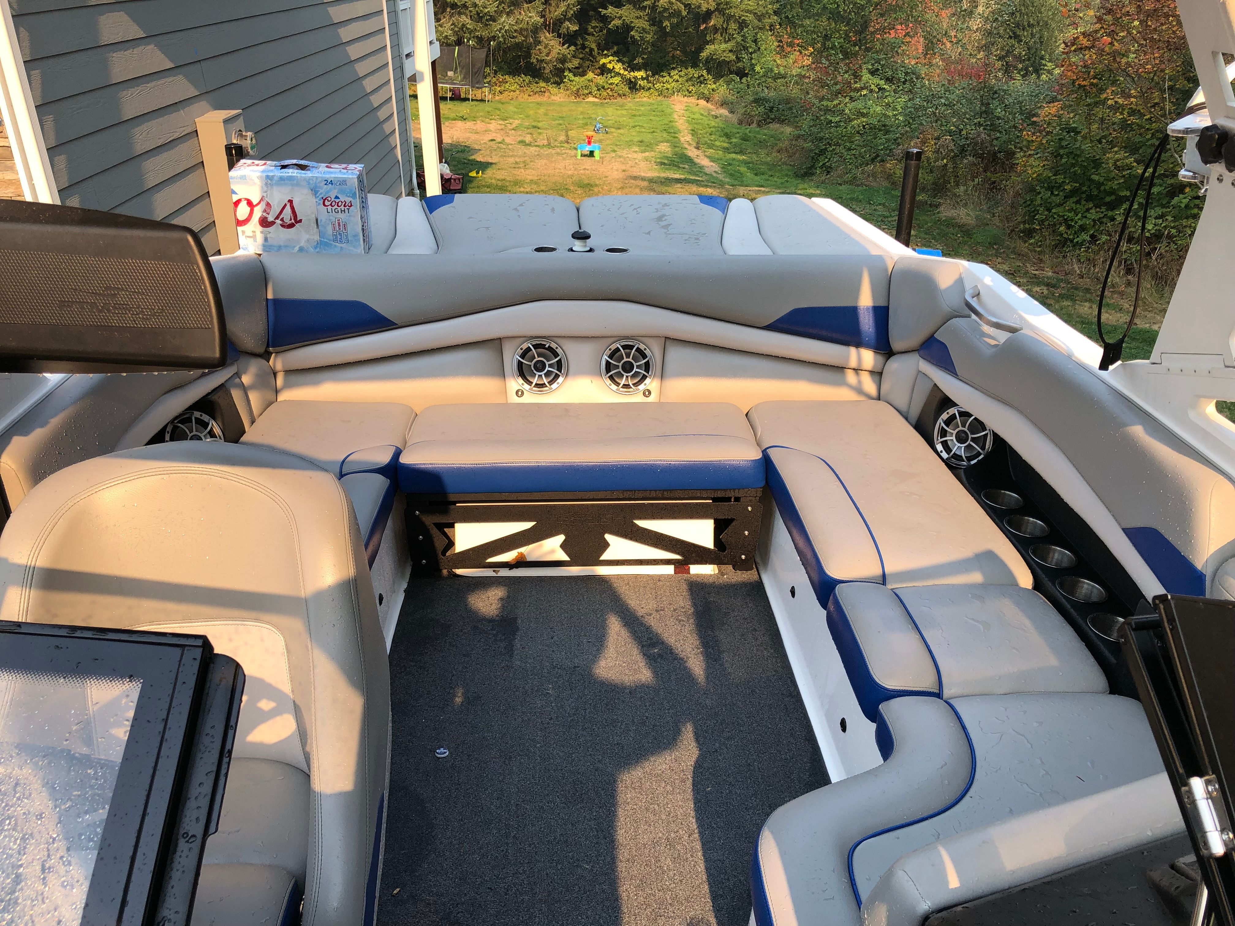 Interior of a 2015 Custom a22 boat with blue and gray seating.