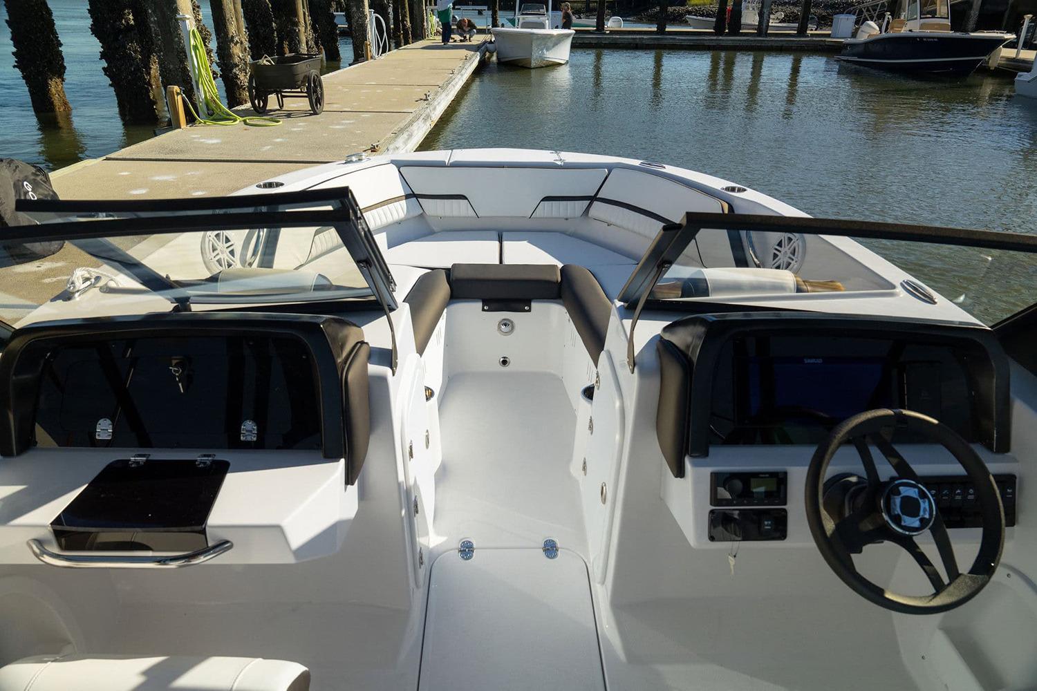 Manufacturer Provided Image: 2026 Stingray 20 SBX boat interior at dock, featuring sleek design and modern controls.