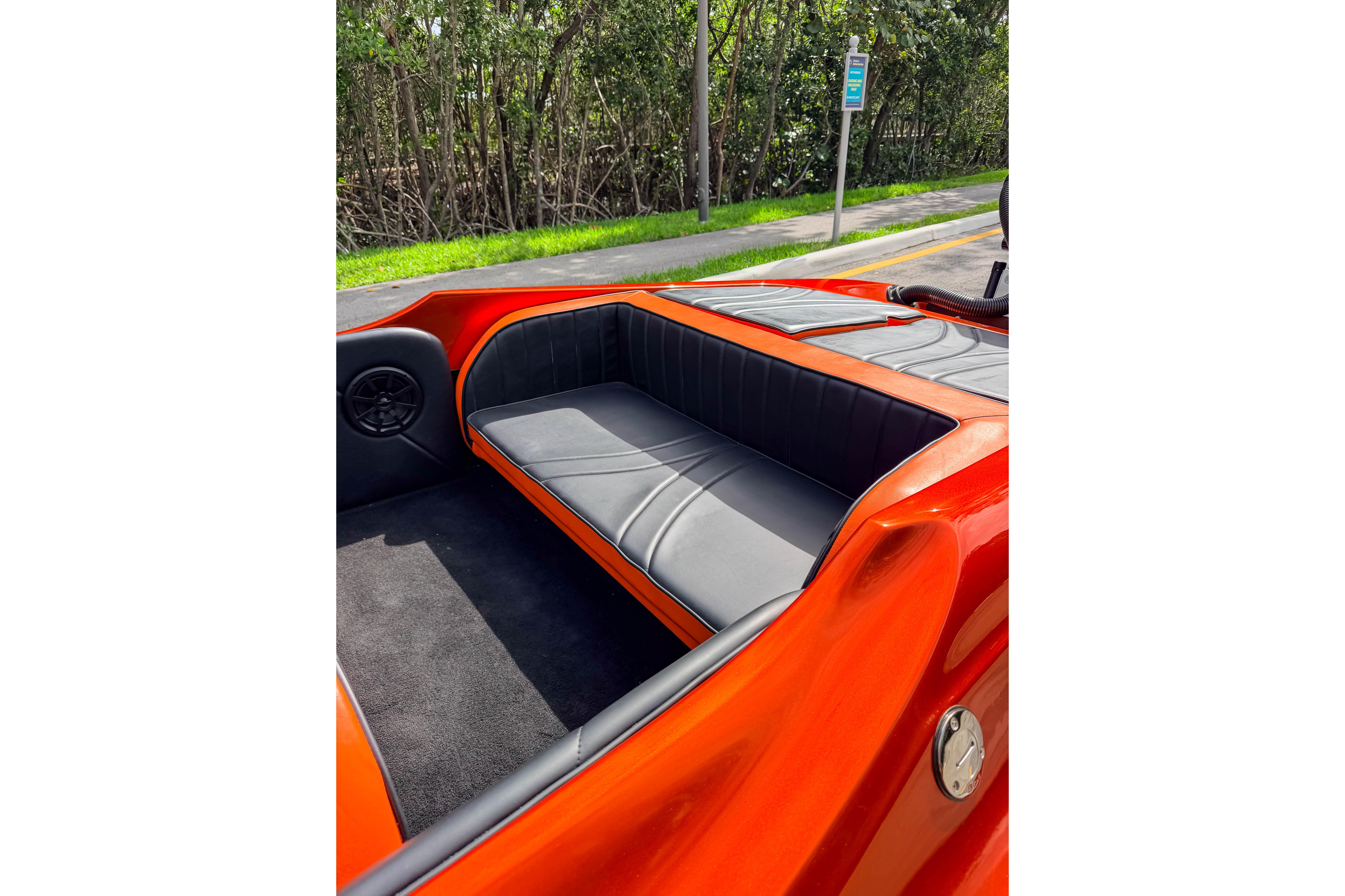 1984 Sleekcraft Aristocrat 20 boat interior with orange and black seating.