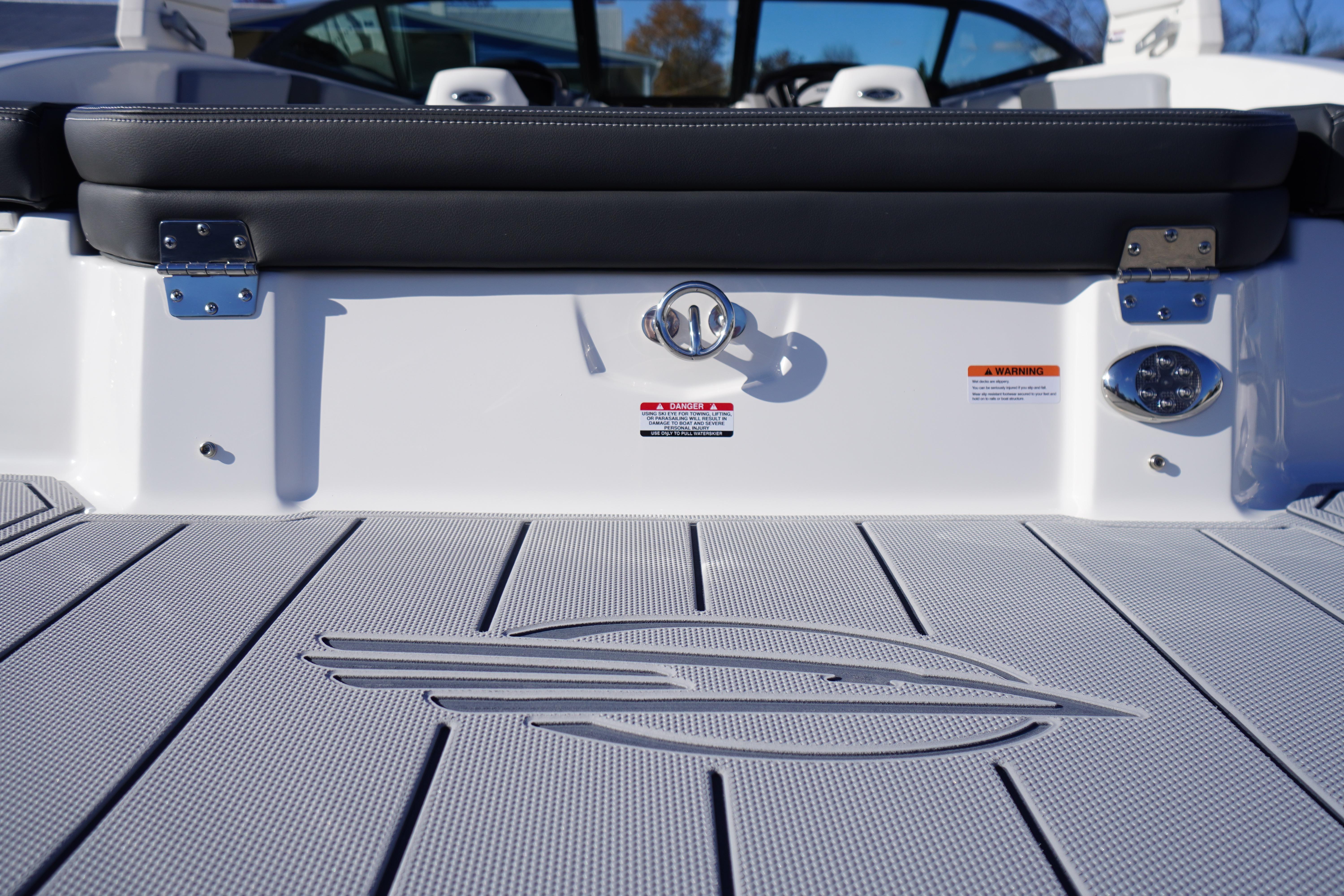 2026 Chaparral 23 SSi boat deck with logo and seating detail.
