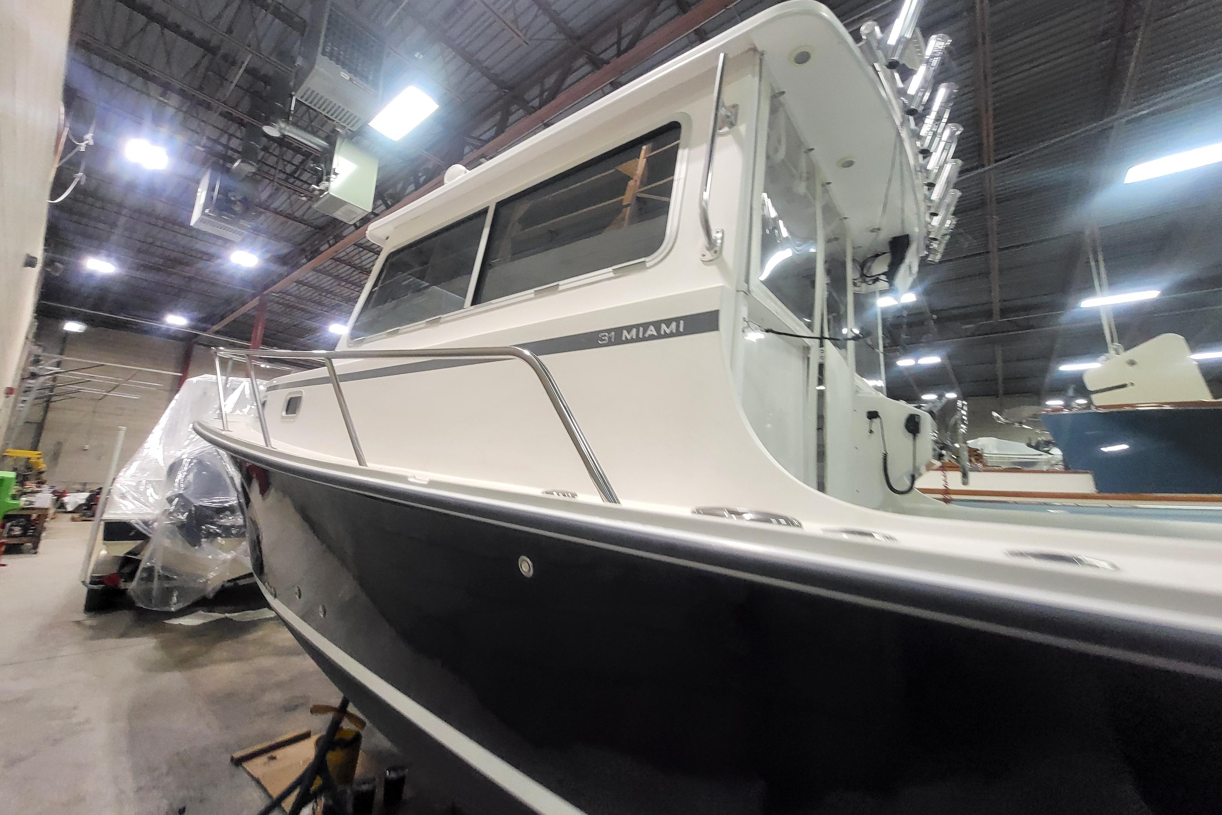 2020 Steiger Craft 31 Miami boat in a warehouse setting.