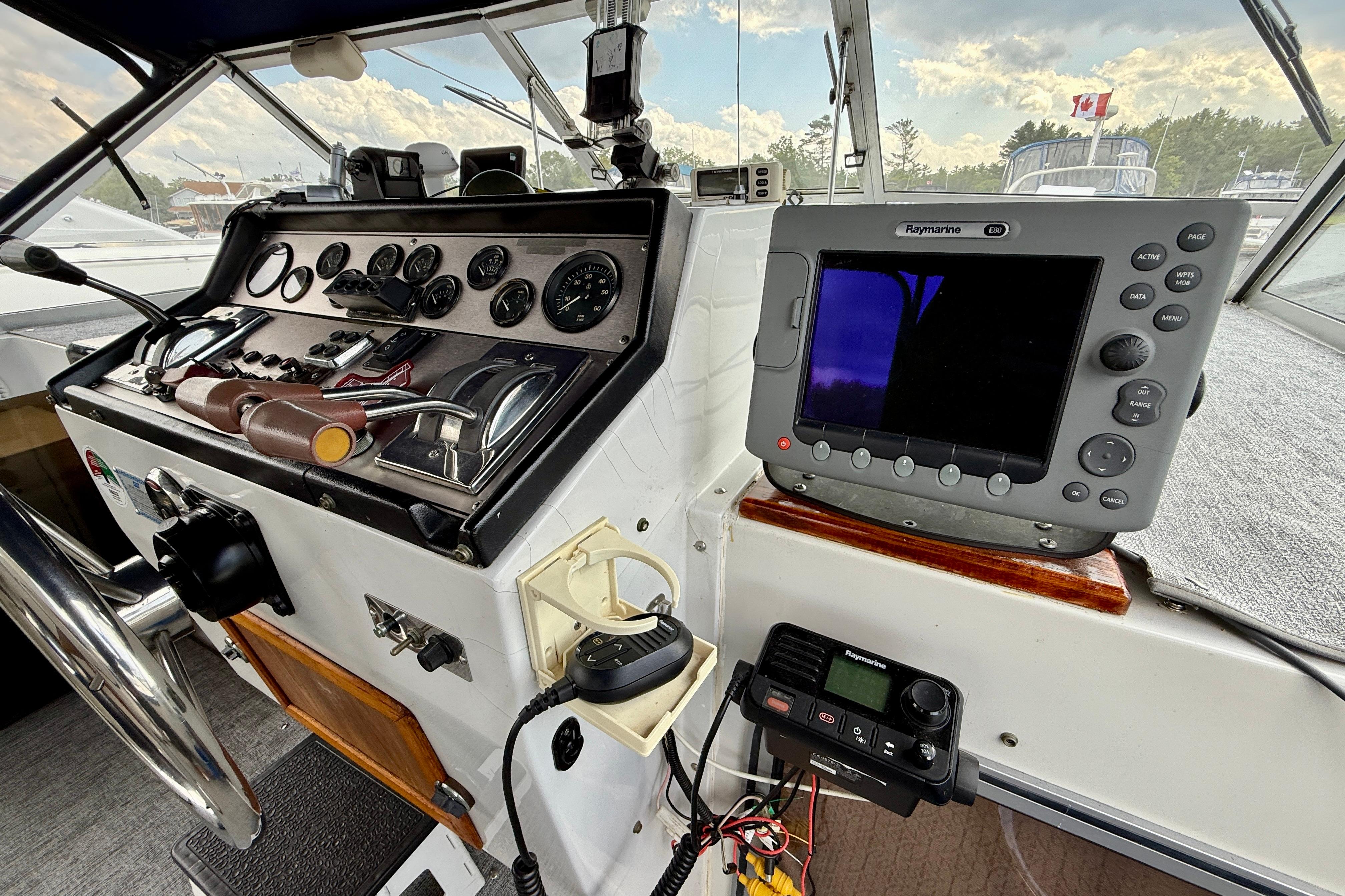 1988 Chris-Craft 381 Catalina helm with navigation equipment and control panel.