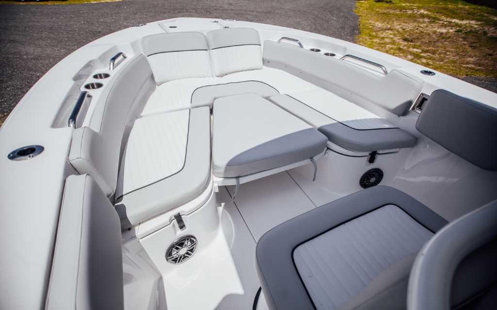 2021 Sea Fox 248 Commander boat interior with cushioned seating and cup holders.
