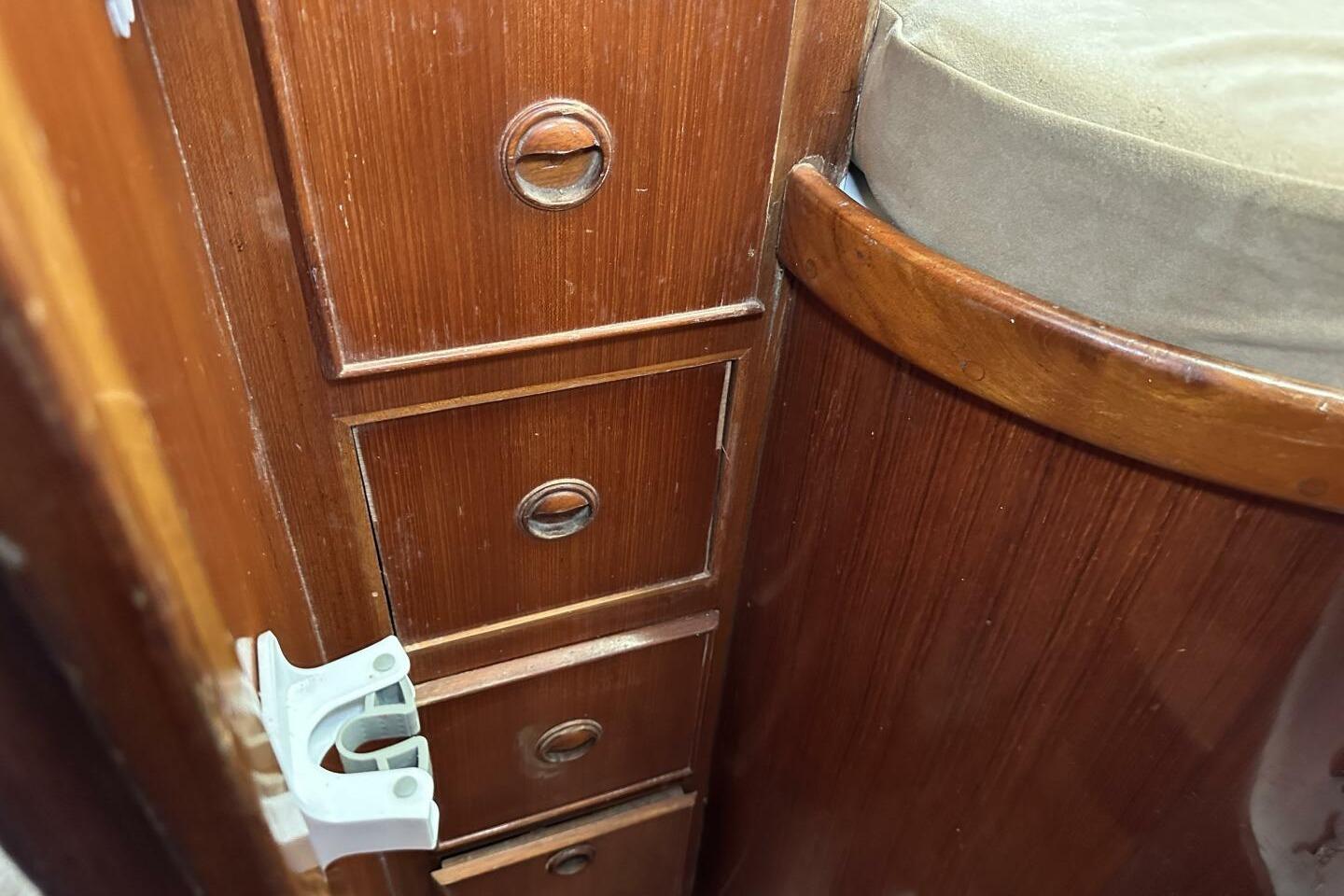 Wooden interior drawers and seat in 1986 Pan-Oceanic 46 boat cabin.