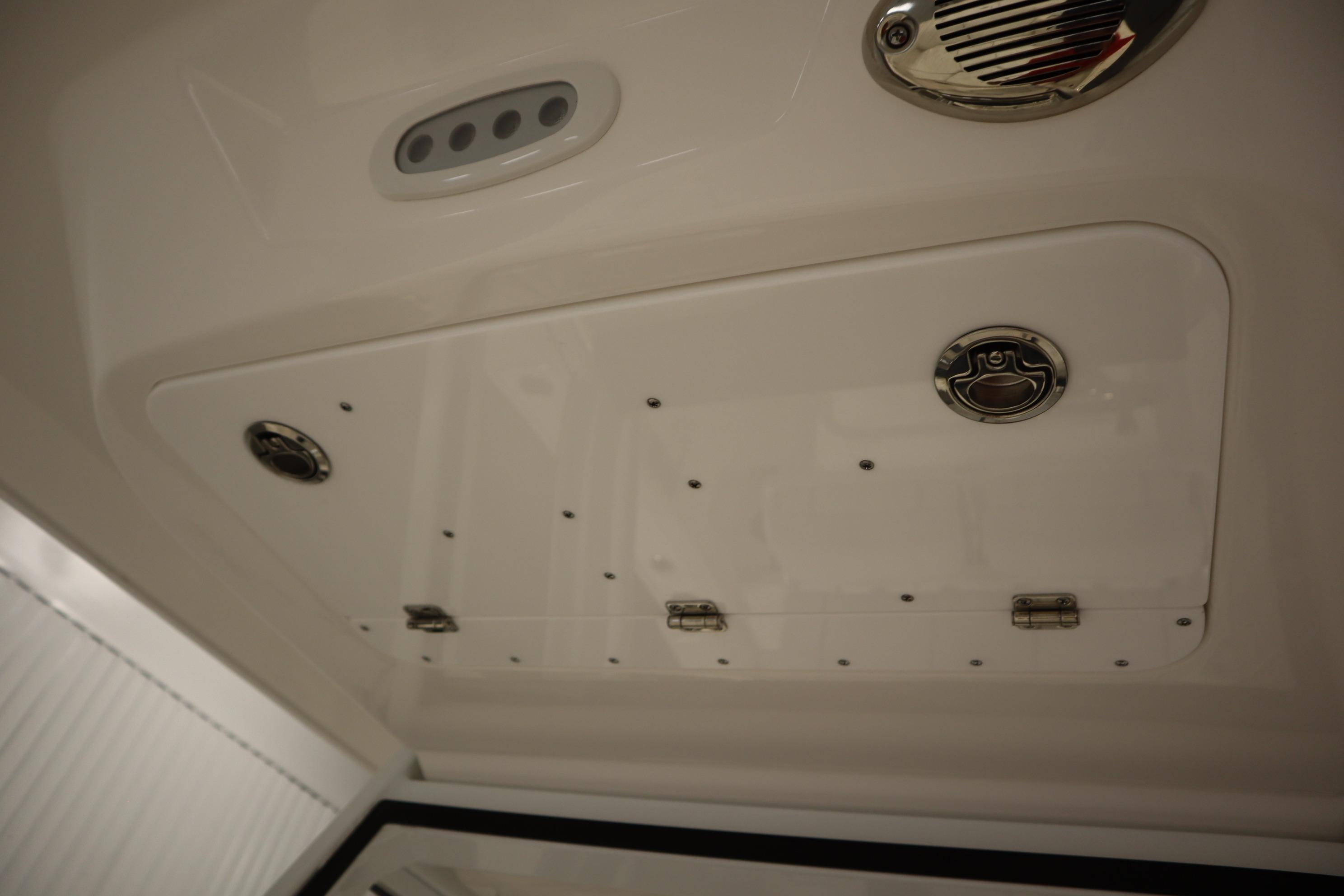 Ceiling view of 2026 Sea Fox 228 Commander boat with storage compartment and speaker.