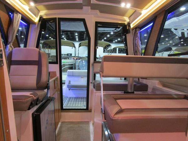 Interior of 2025 Cutwater C-248 Coupe boat, featuring modern seating and ambient lighting.