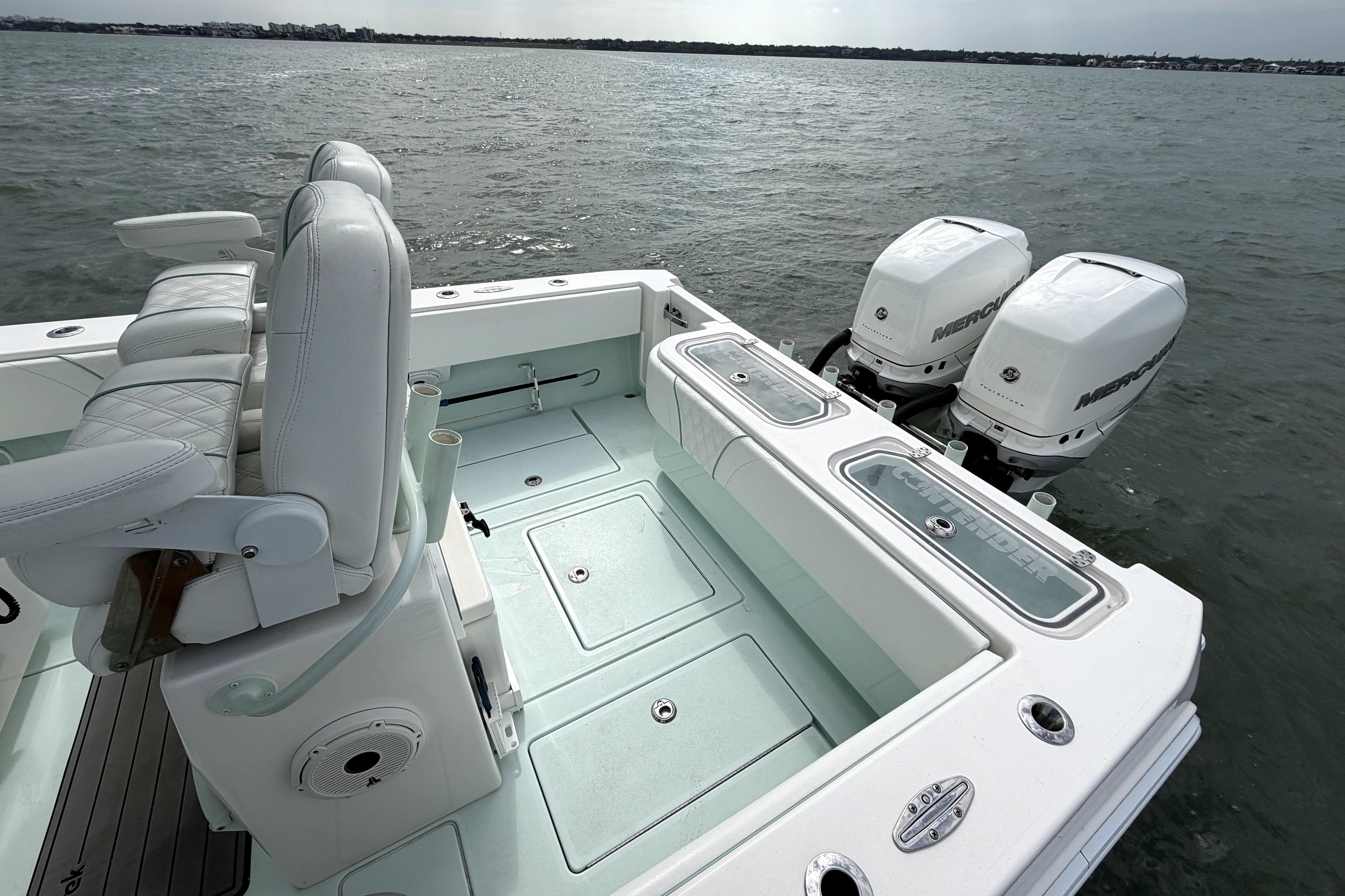 2019 Contender 30 ST boat with dual Mercury outboard engines on open water.