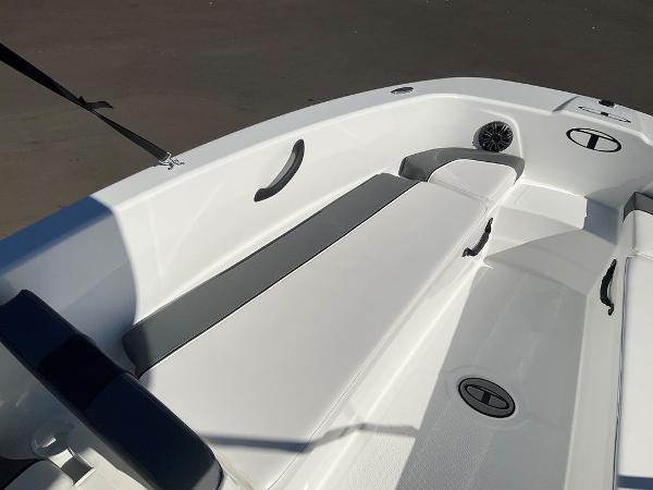 2025 Tahoe T18 boat interior with white seating and storage compartments.