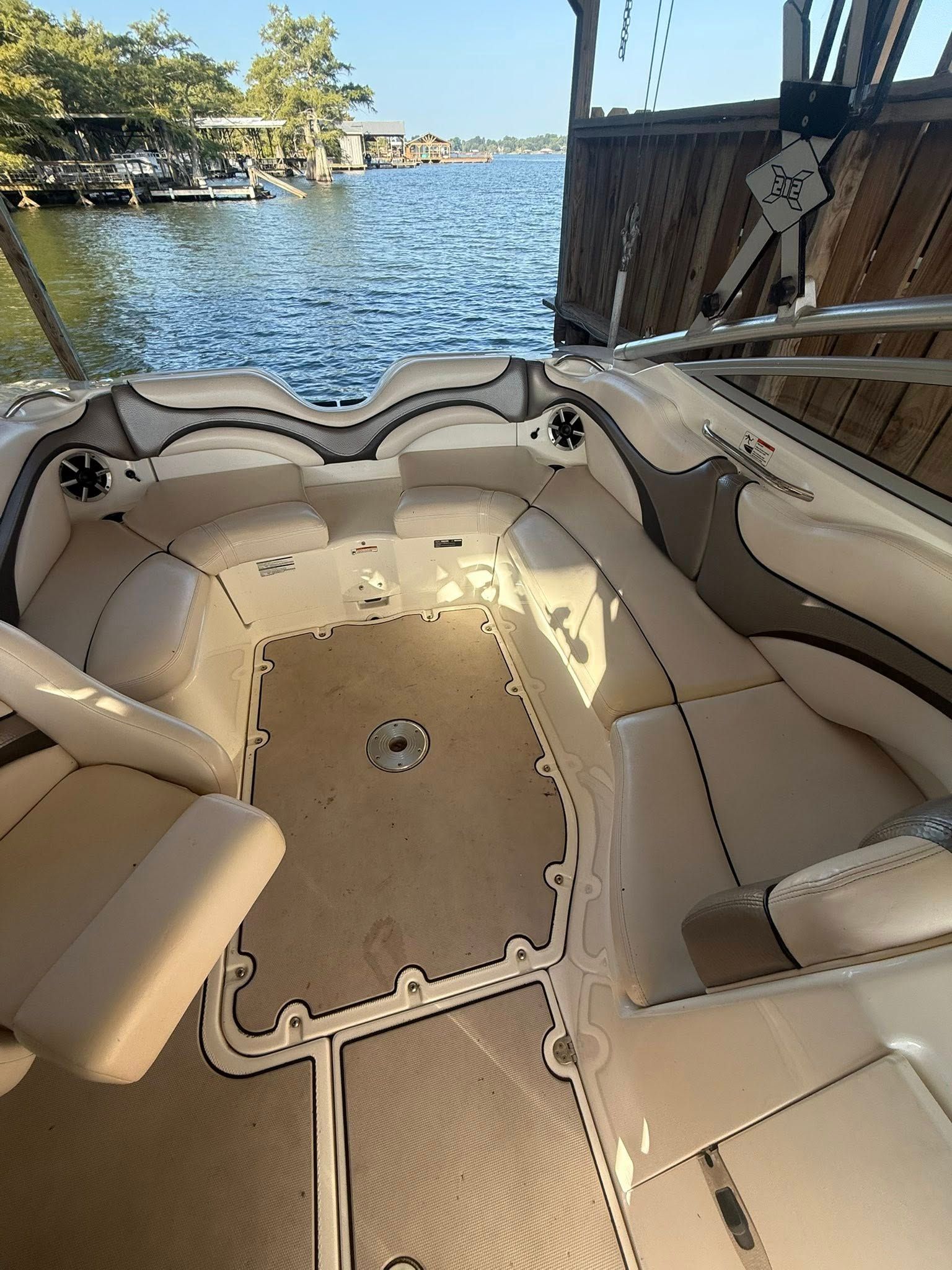 Interior of a 2008 Yamaha Boats 212X overlooking the lake.