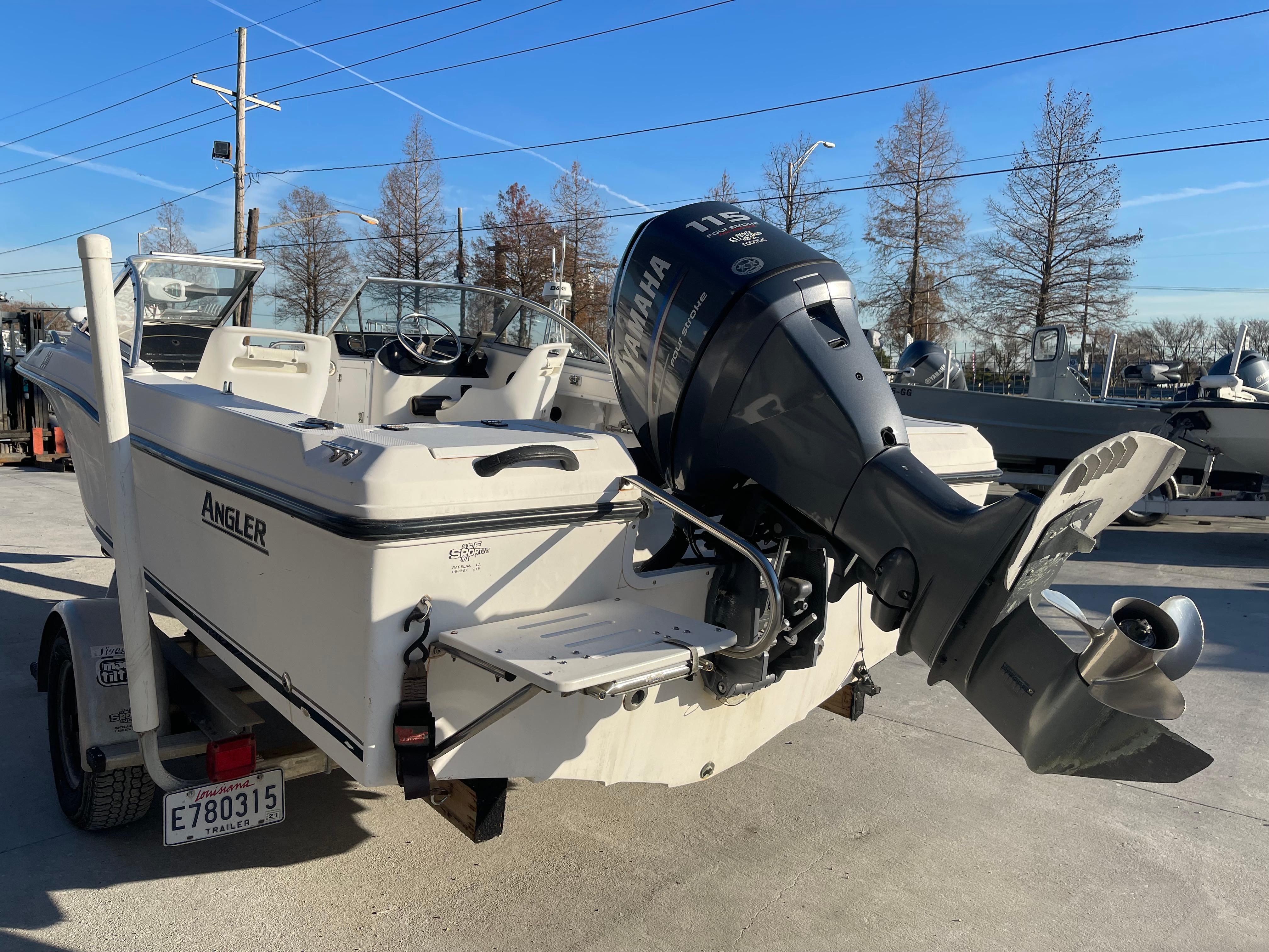 2002 Angler 18 DC boat with Yamaha outboard motor on trailer.