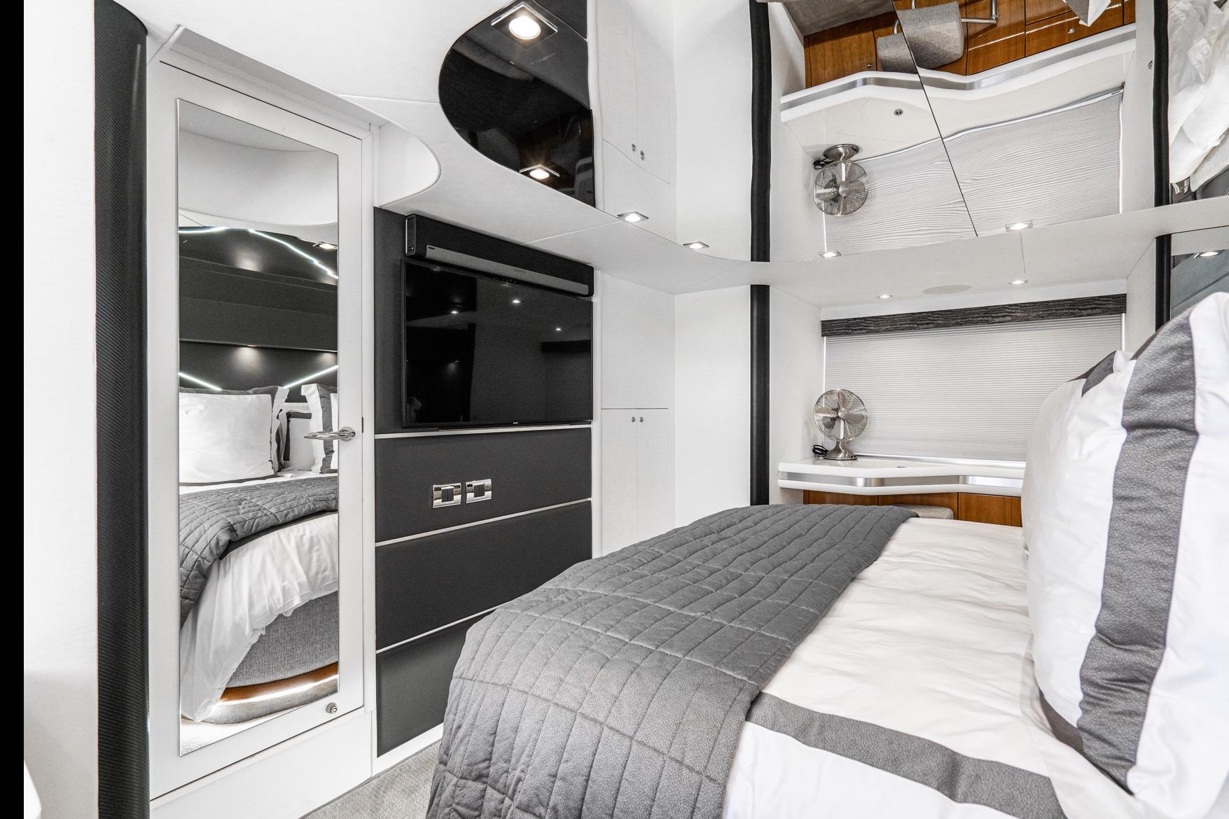 Luxurious Sunseeker Predator 68 yacht bedroom interior, 2021 model, featuring modern design and elegant decor.