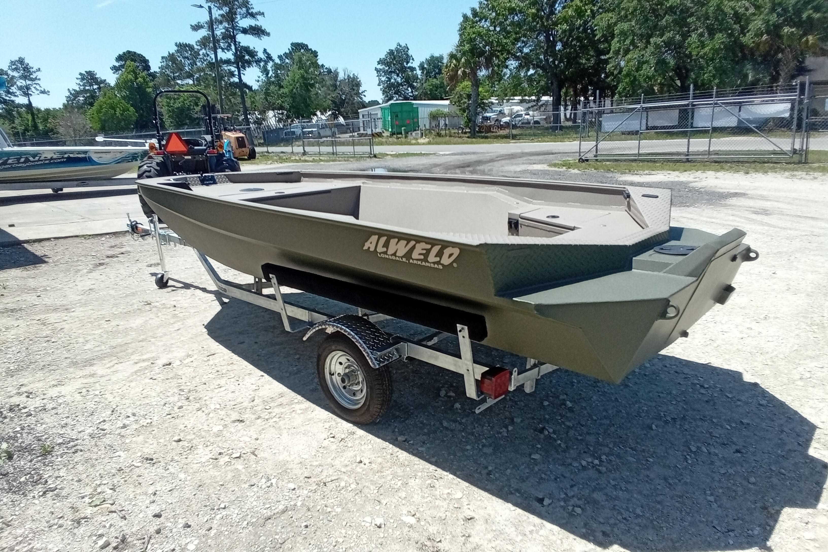 2026 Alweld 1652 Invader boat on trailer, parked outdoors.