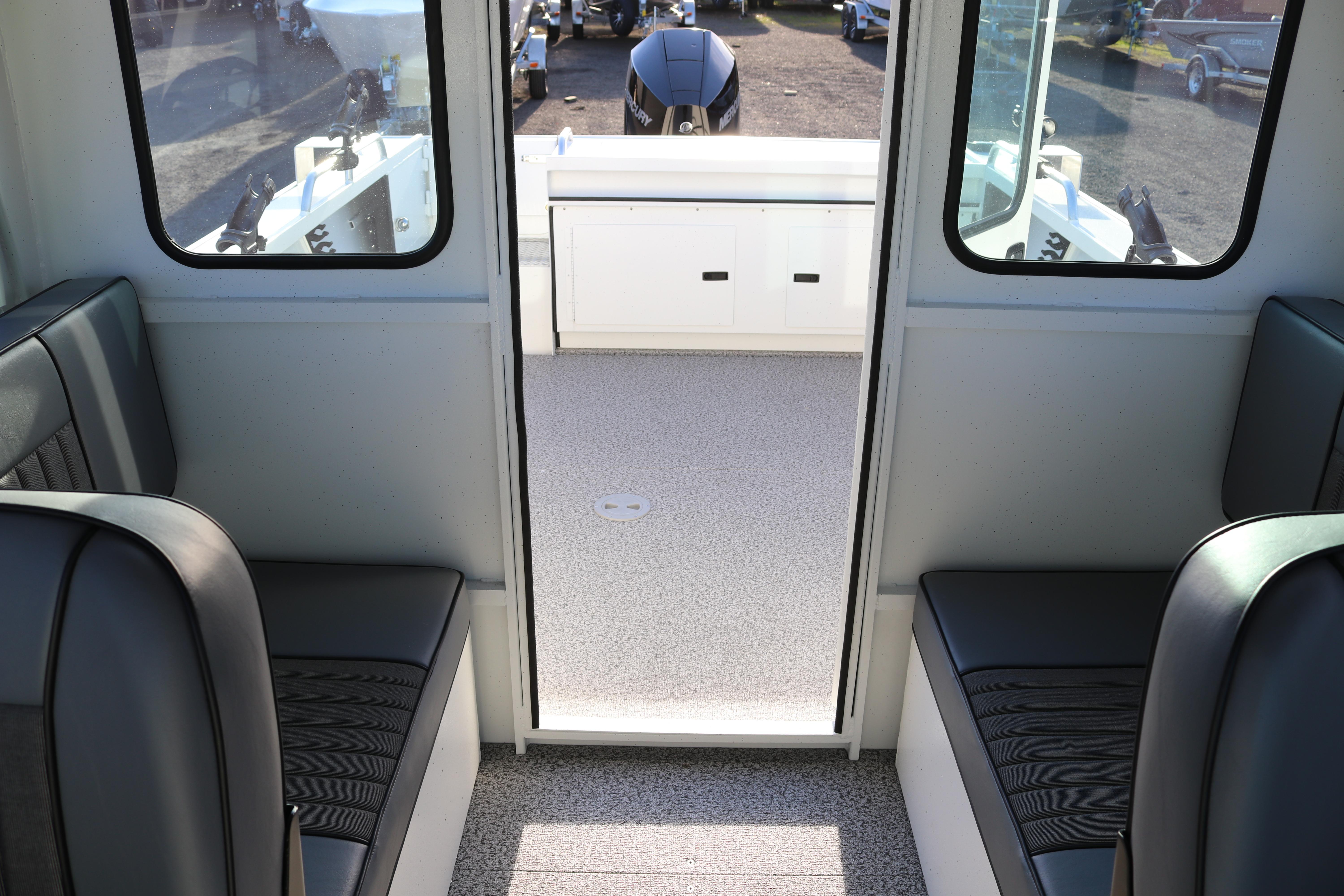 Interior view of 2026 Alumaweld Intruder Outboard 22 boat with seating and storage.