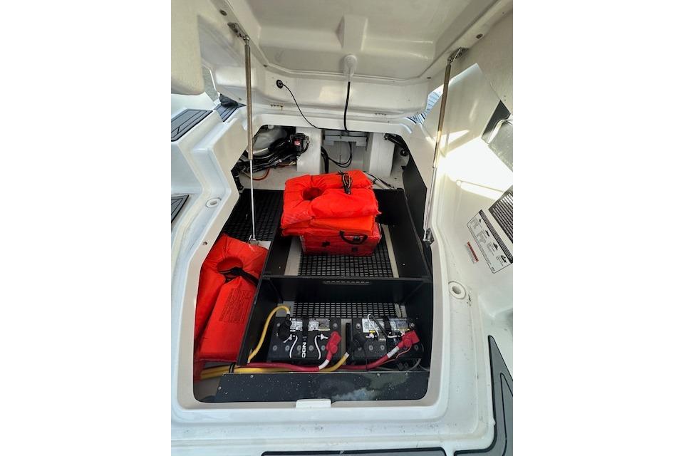 2022 Monterey 255SS Super Sport boat storage with life jackets and battery compartment.